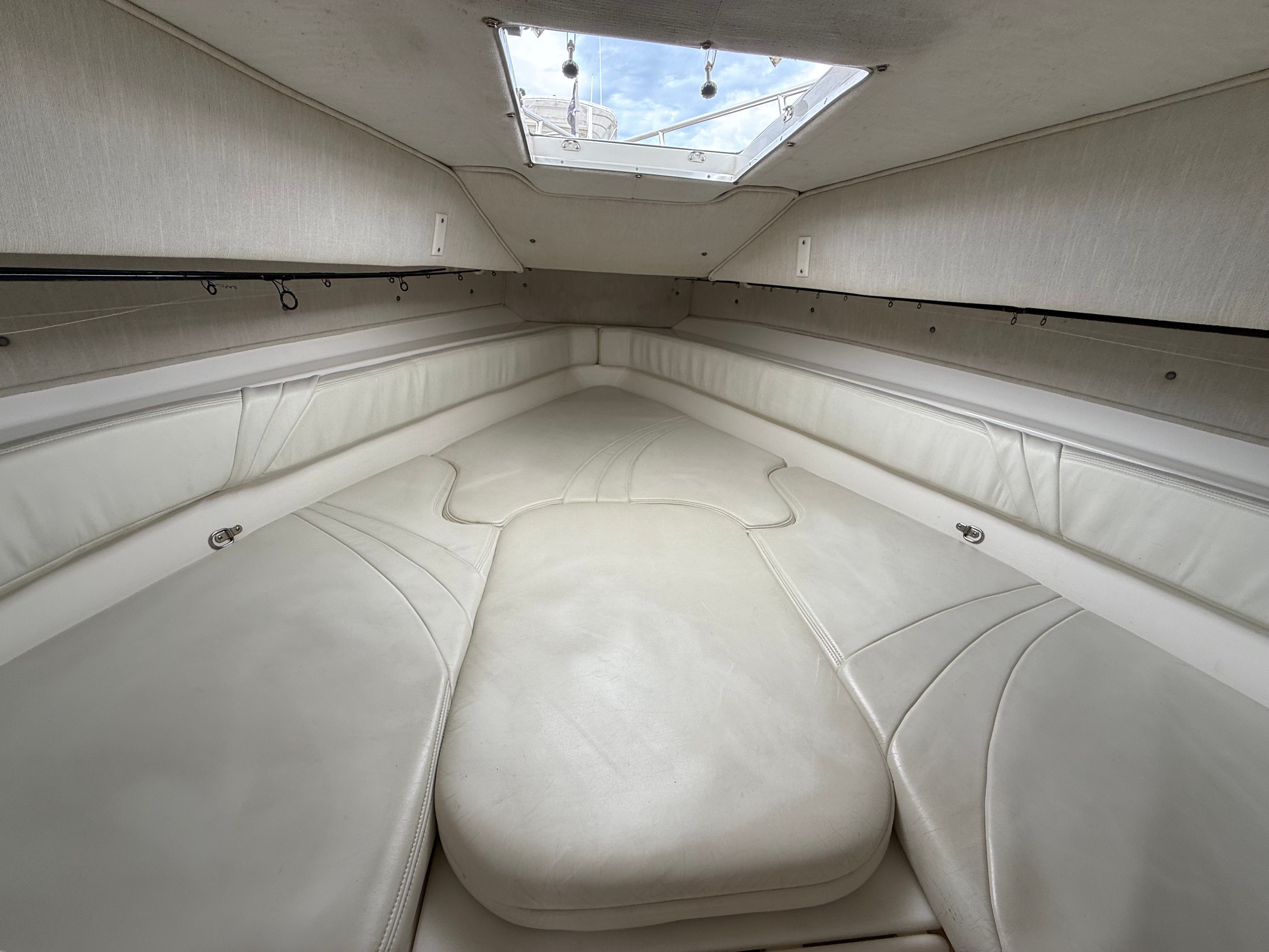 Interior of 1999 Fountain 32 Sport Fish Cruiser with white upholstery.