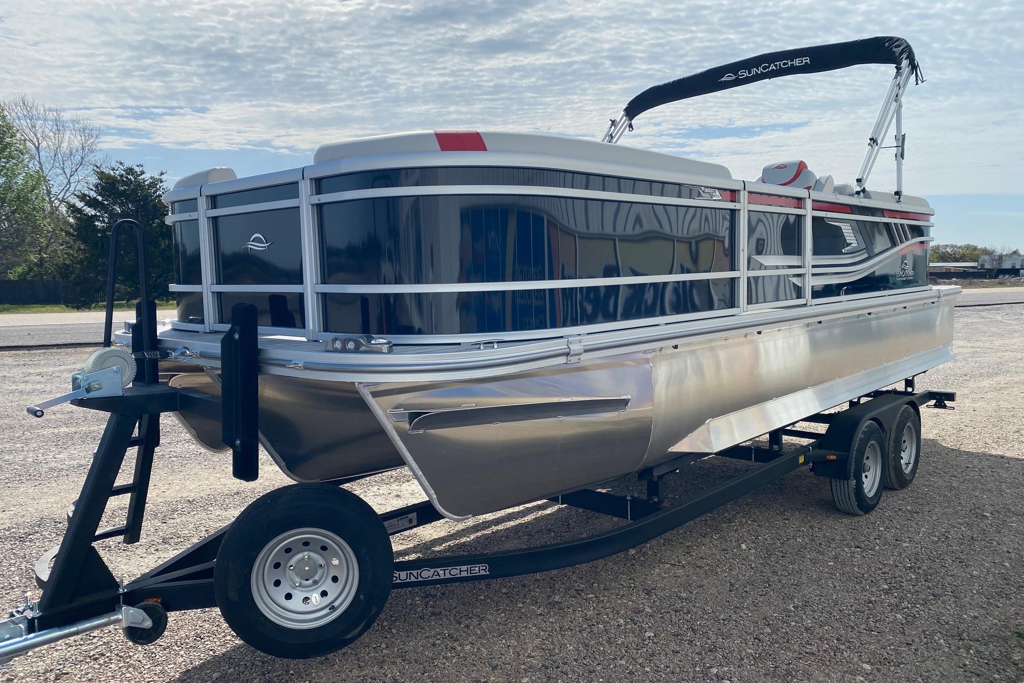2026 SunCatcher Select 322RC pontoon boat on trailer, parked outdoors.