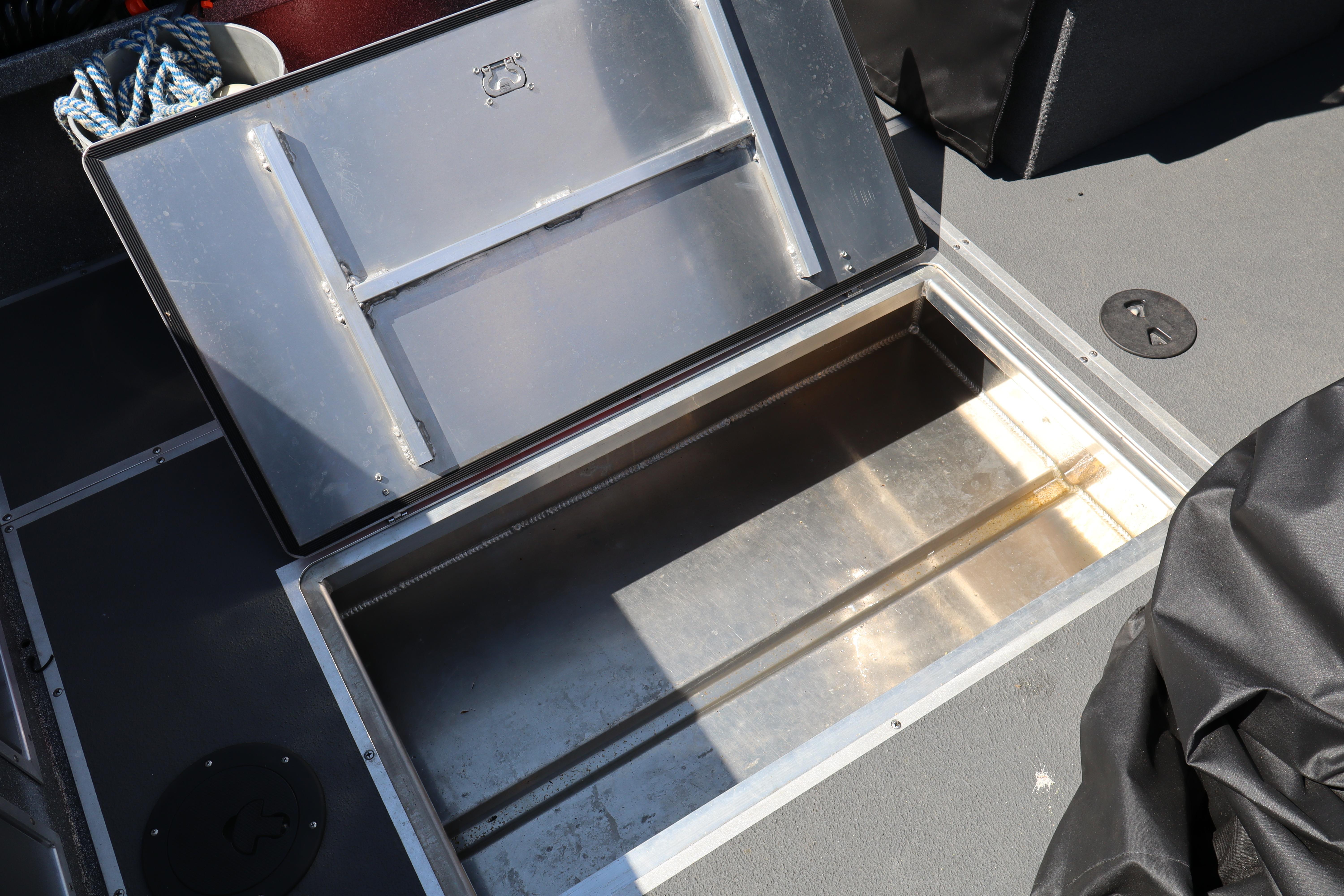 Open storage compartment on 2025 NorthRiver SEAHAWK boat deck.