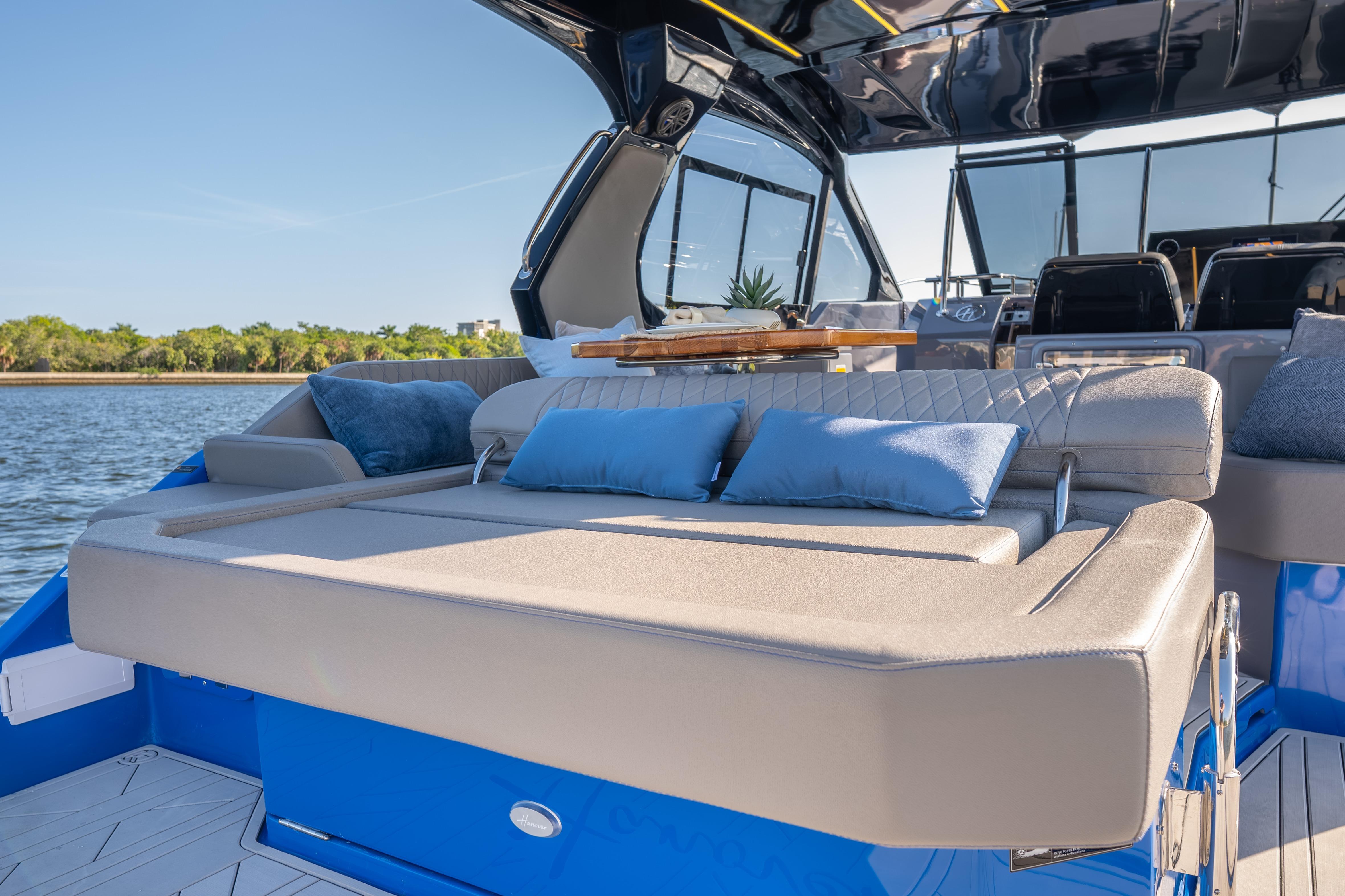 Luxurious 2026 Hanover 347 yacht interior with plush seating and scenic water view.