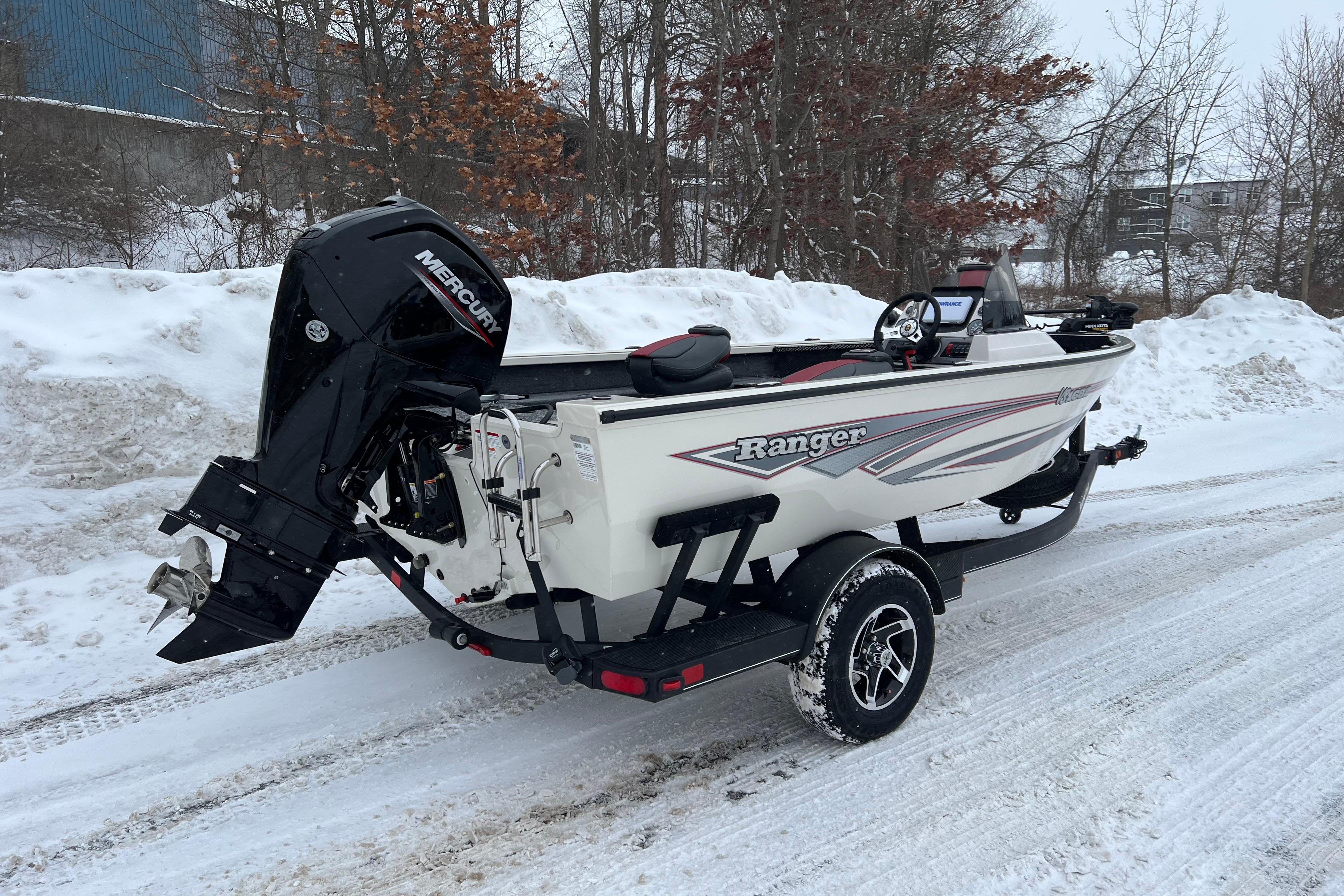 2026 Ranger VS1682SC Angler boat on snowy road with Mercury outboard motor.