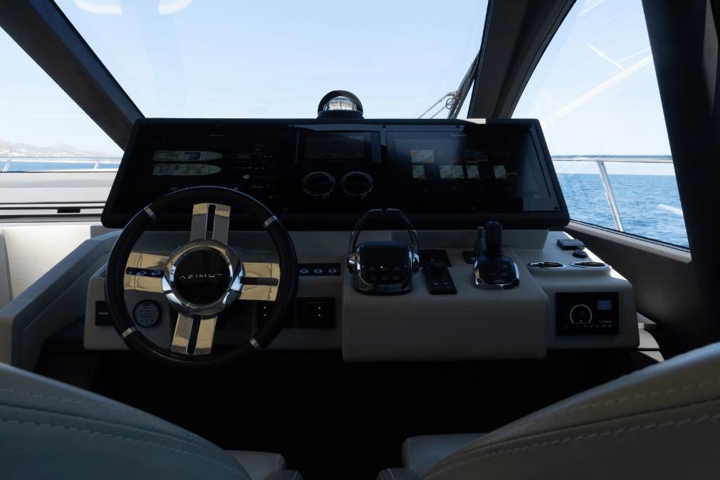 Cockpit of 2020 Azimut 60 yacht with modern steering and navigation controls.