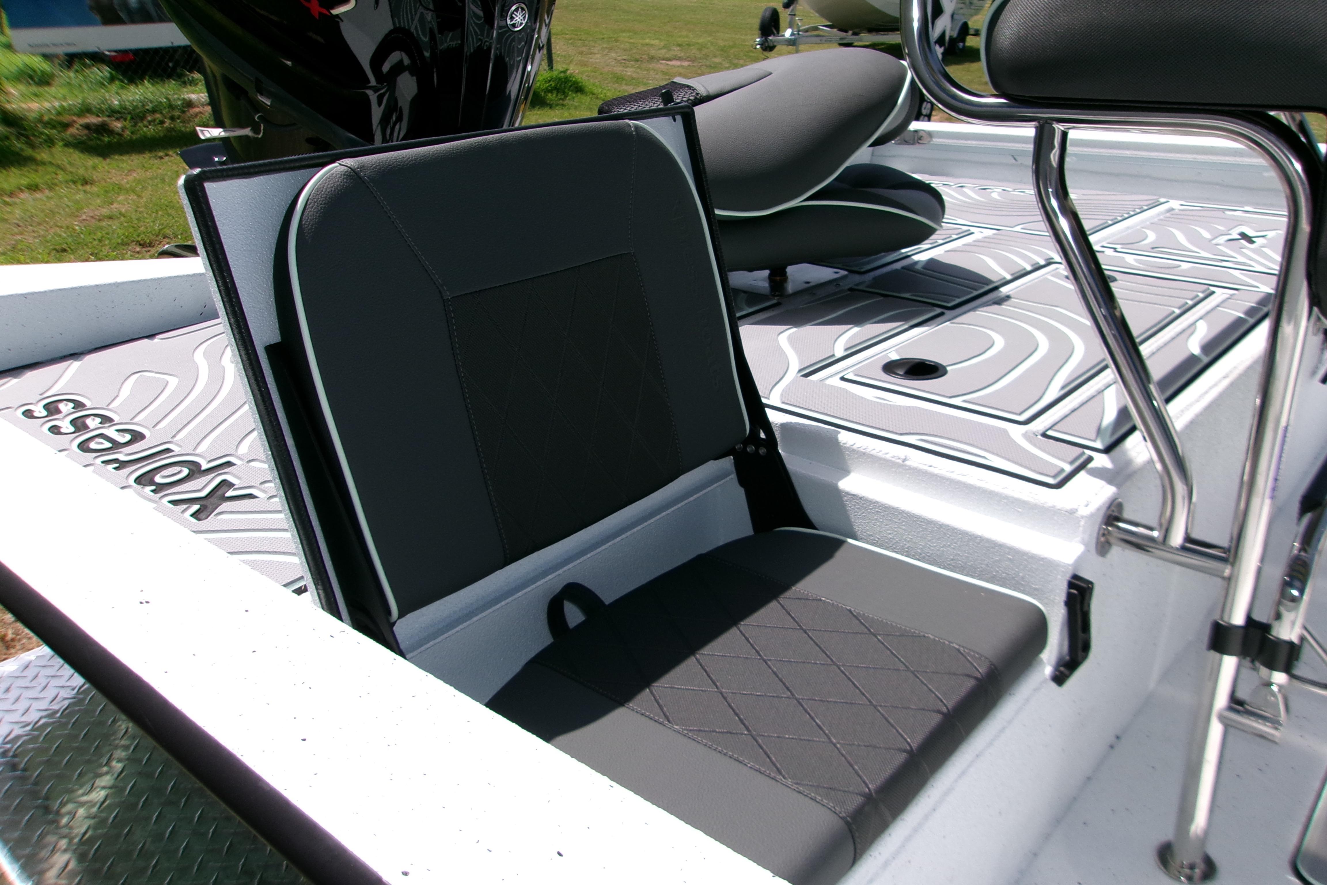 2027 Xpress H22B Bay boat interior with cushioned seating and sleek design.
