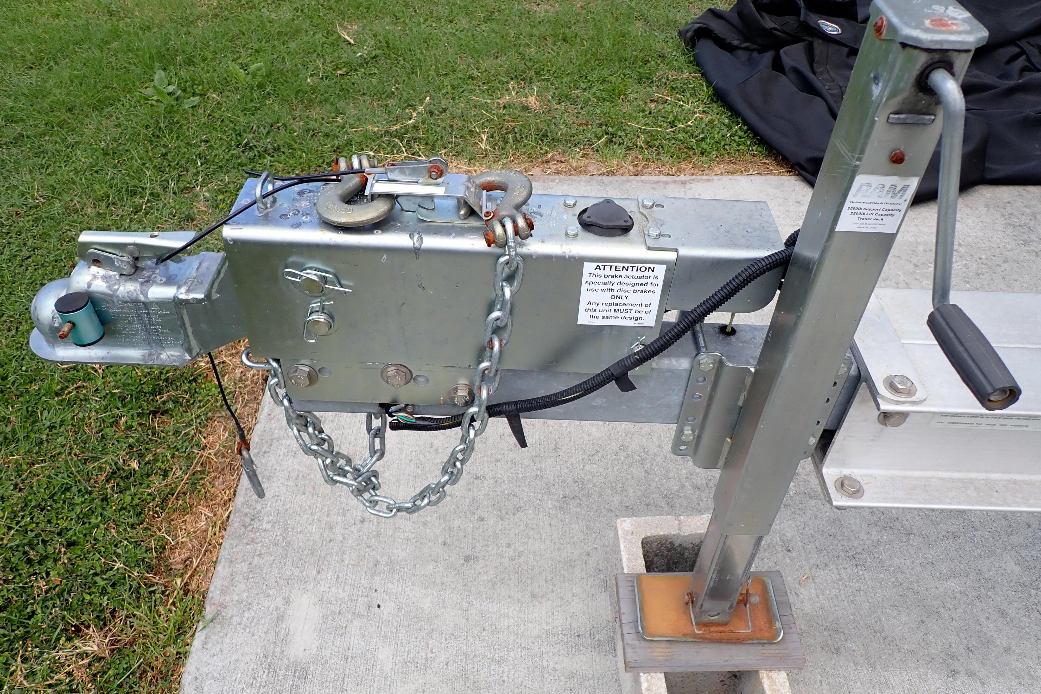 Trailer hitch mechanism for 2019 Key West 263 FS boat on concrete surface.
