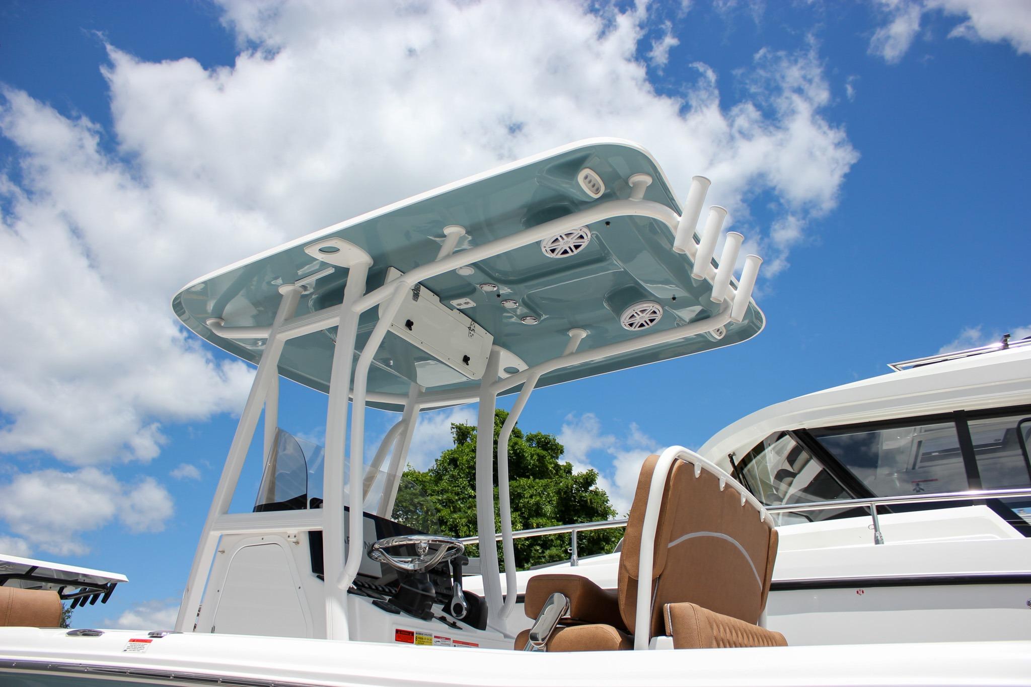 Sea Hunt Ultra 234 boat, 2027 model, featuring a sleek design under a clear blue sky.