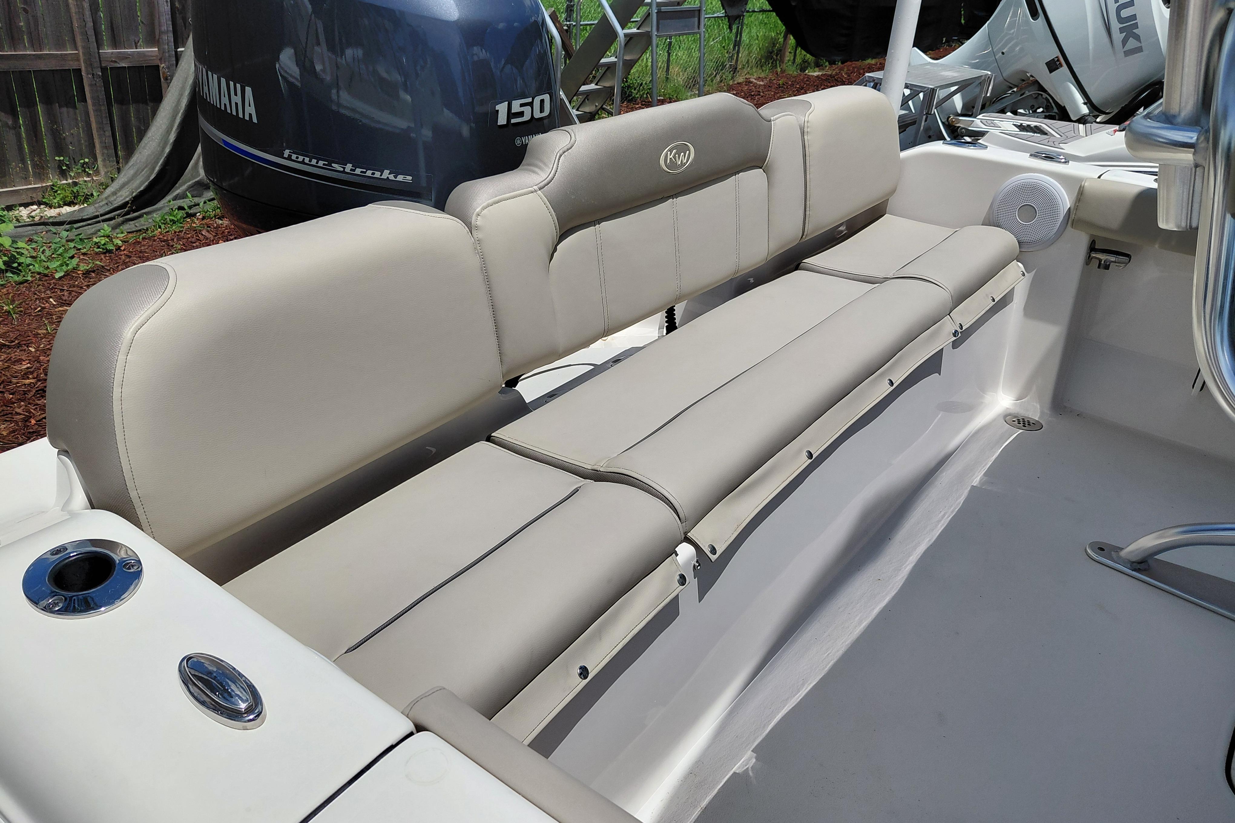 2023 Key West 189 FS boat interior with beige seating and Yamaha engine.