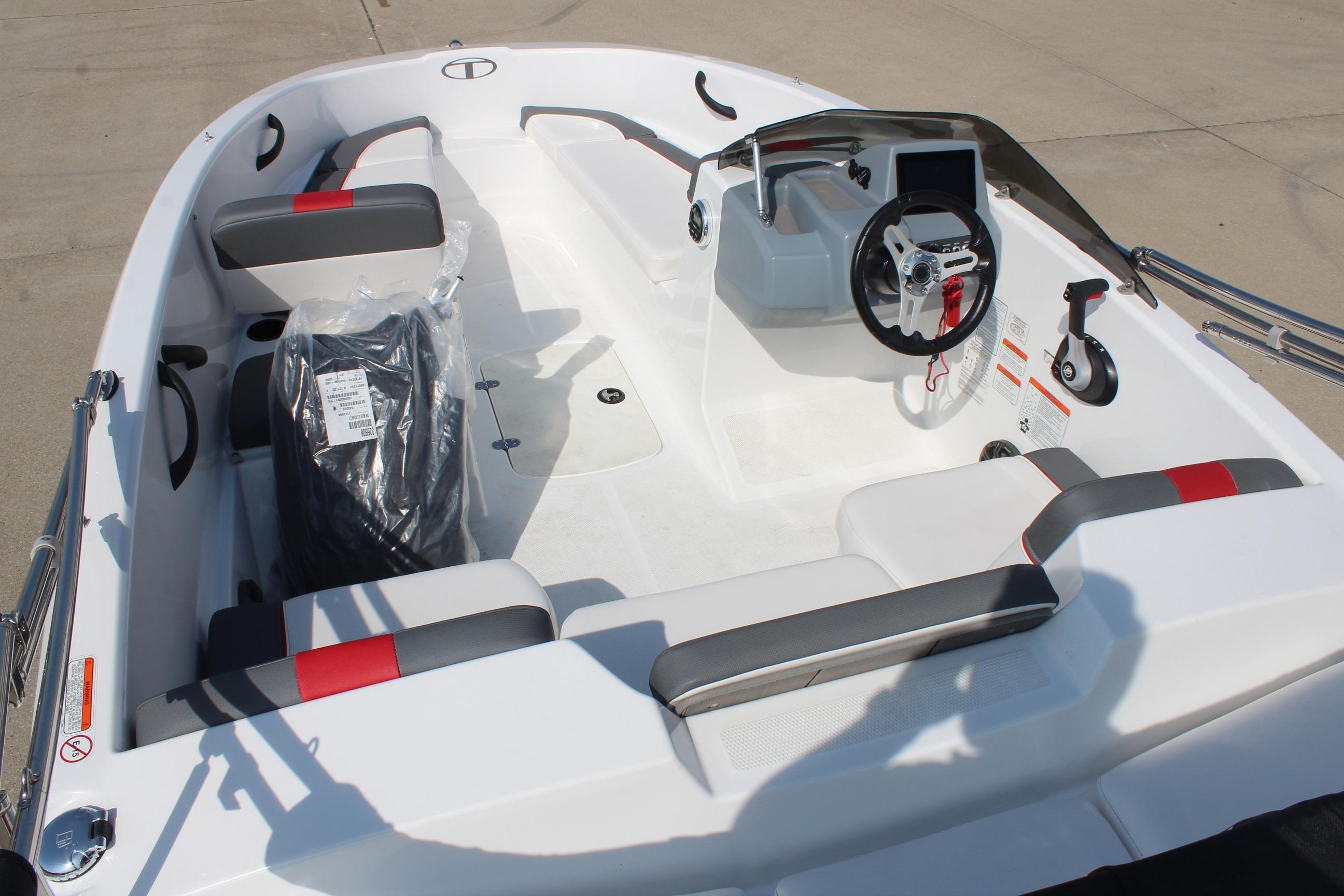 2023 Tahoe T16 boat interior with modern steering and seating design.