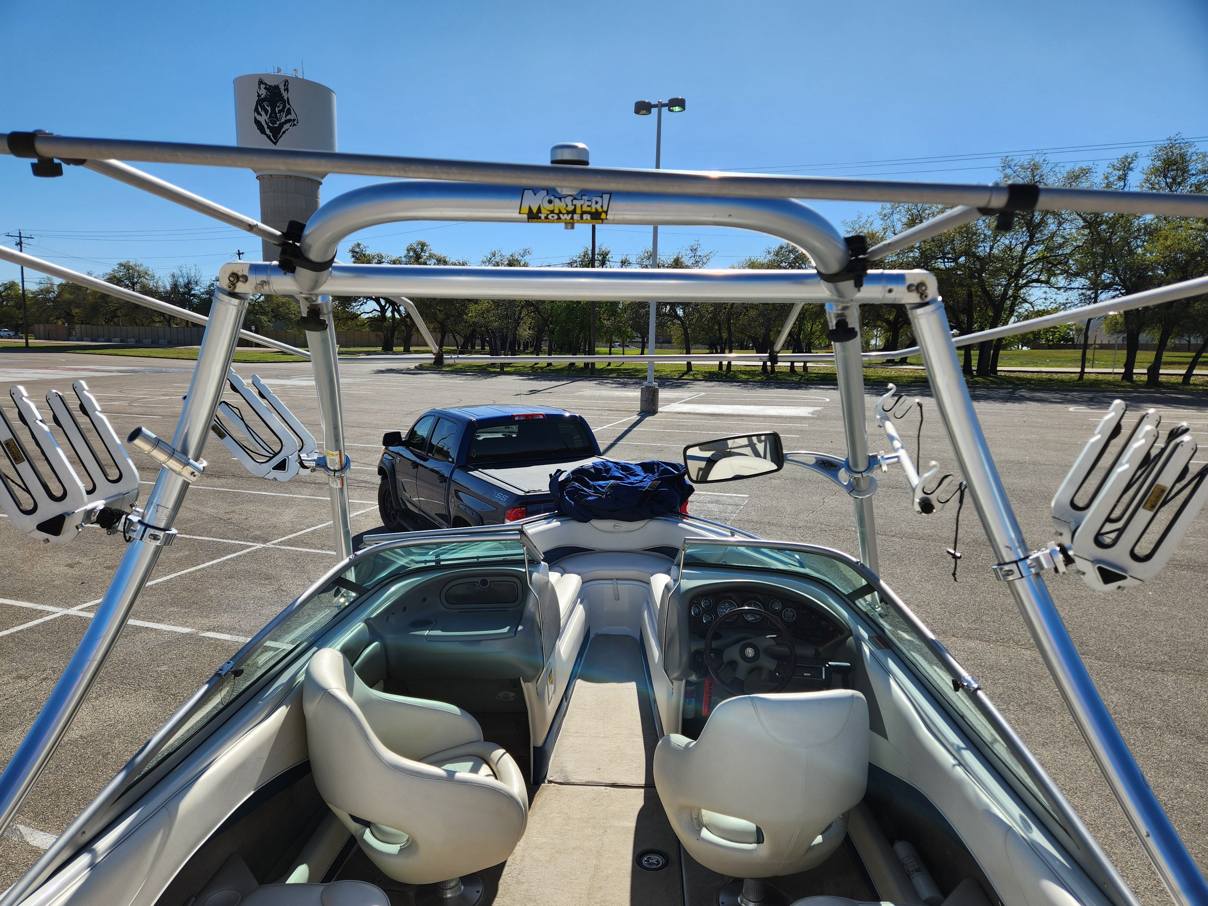 2003 Crownline 225 BR boat in parking lot with trailer.