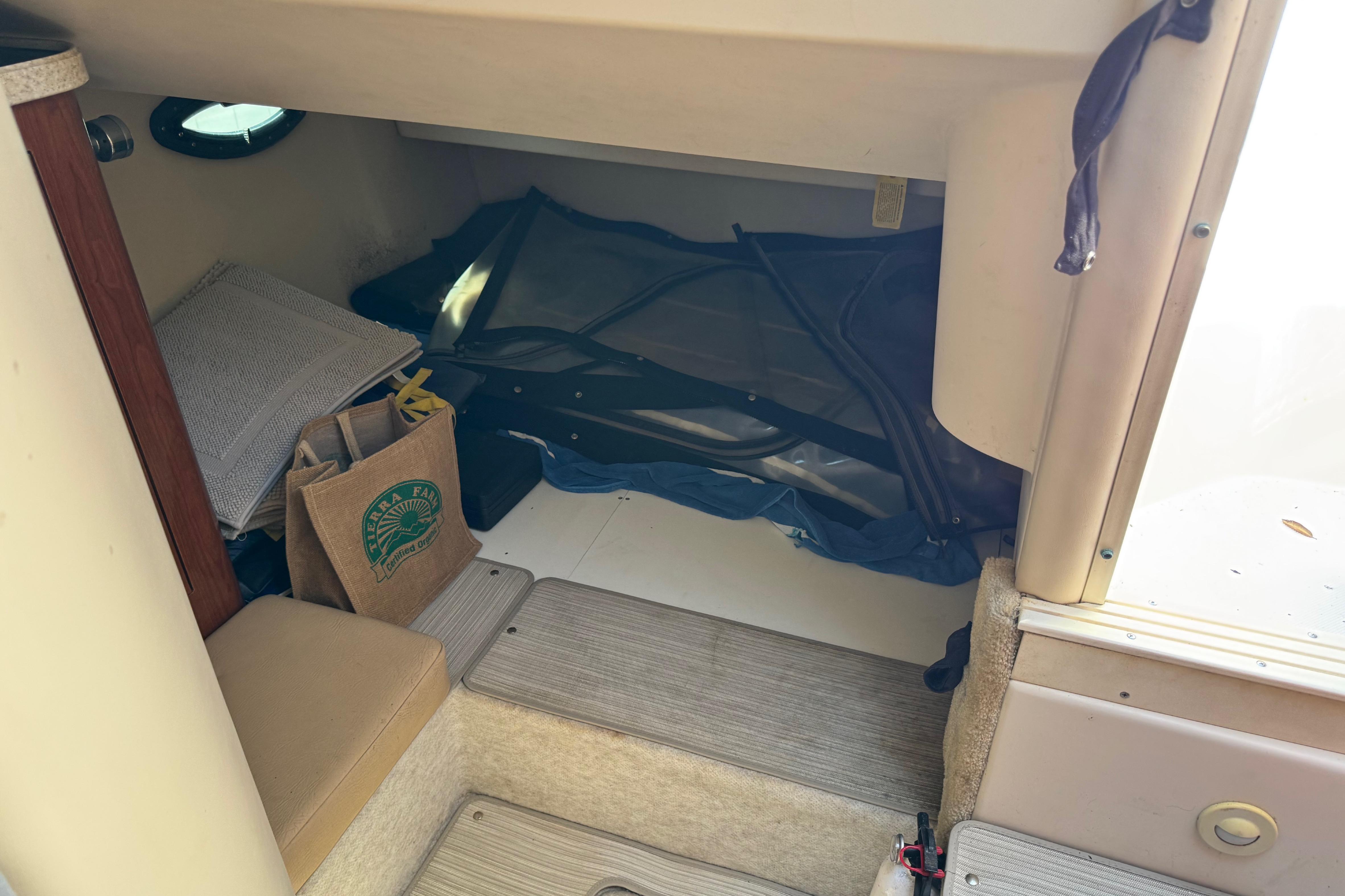 Interior cabin of 2007 Regal Commodore 2665 boat with storage items.