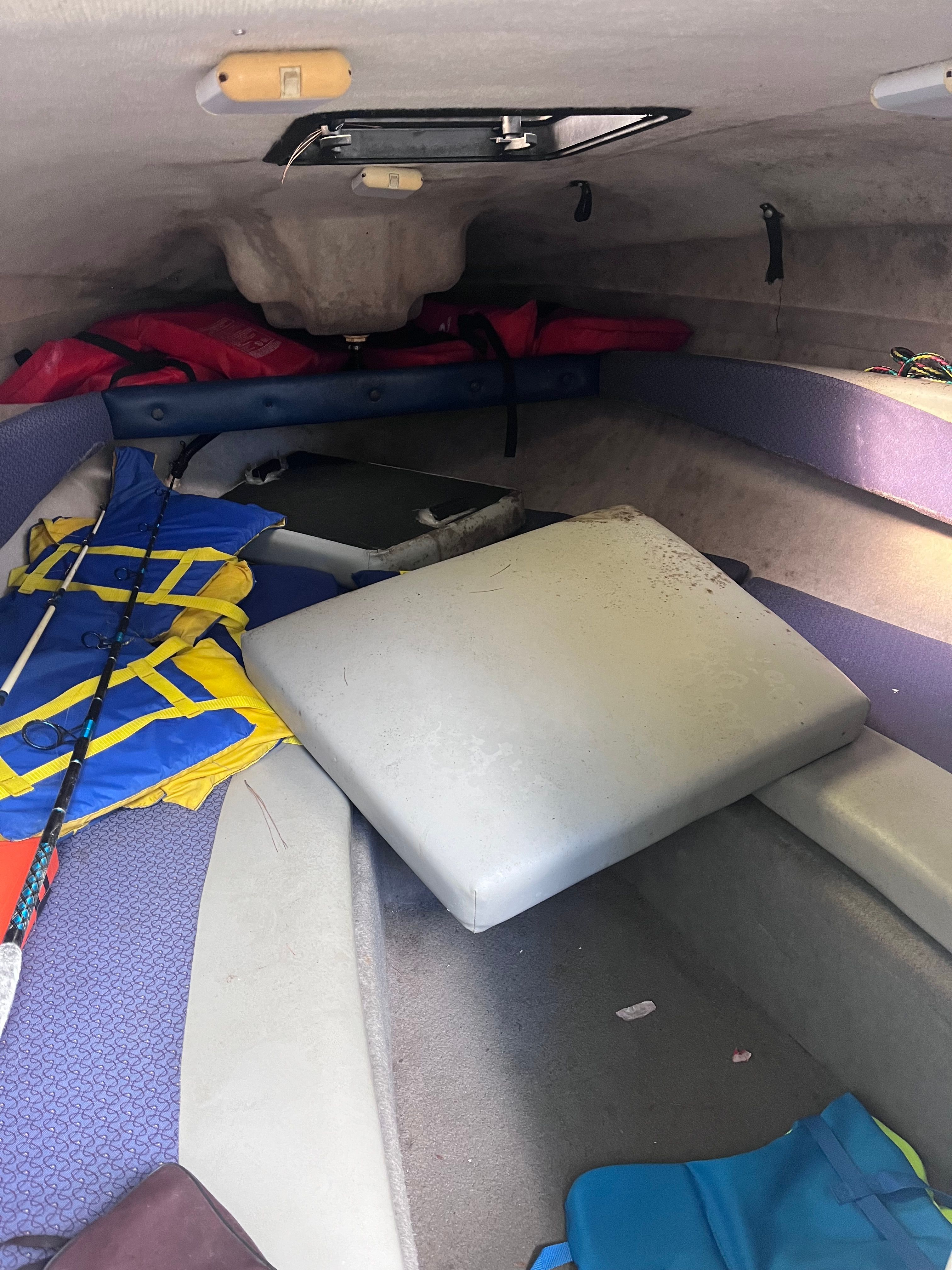 Interior of a 2005 Bayliner Cuddy Capri with life jackets.