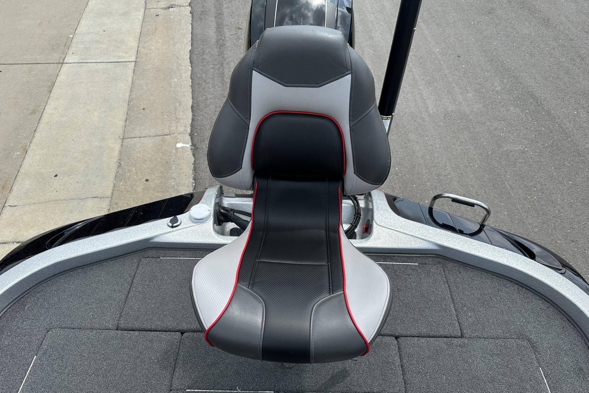 2018 Ranger Z518 boat seat with black, gray, and red accents on a textured deck.
