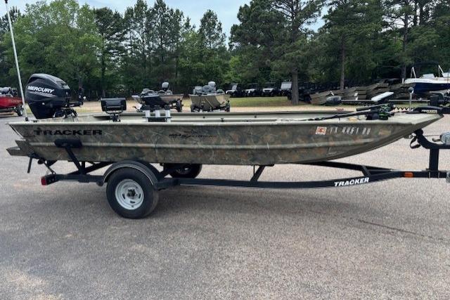 2017 Tracker Grizzly 1654 MVX Sportsman boat on trailer in outdoor setting.