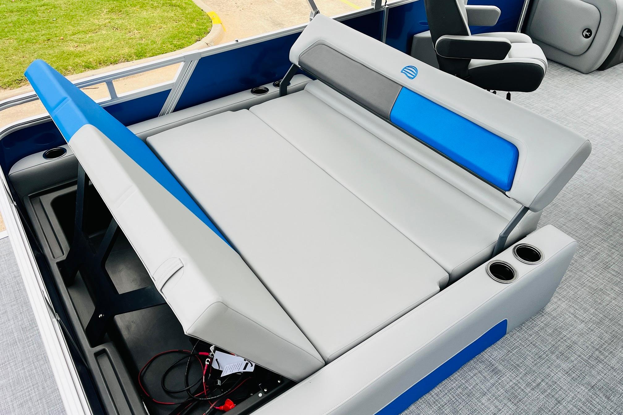 2026 Sun Tracker Party Barge 22 RF DLX interior seating with cup holders.