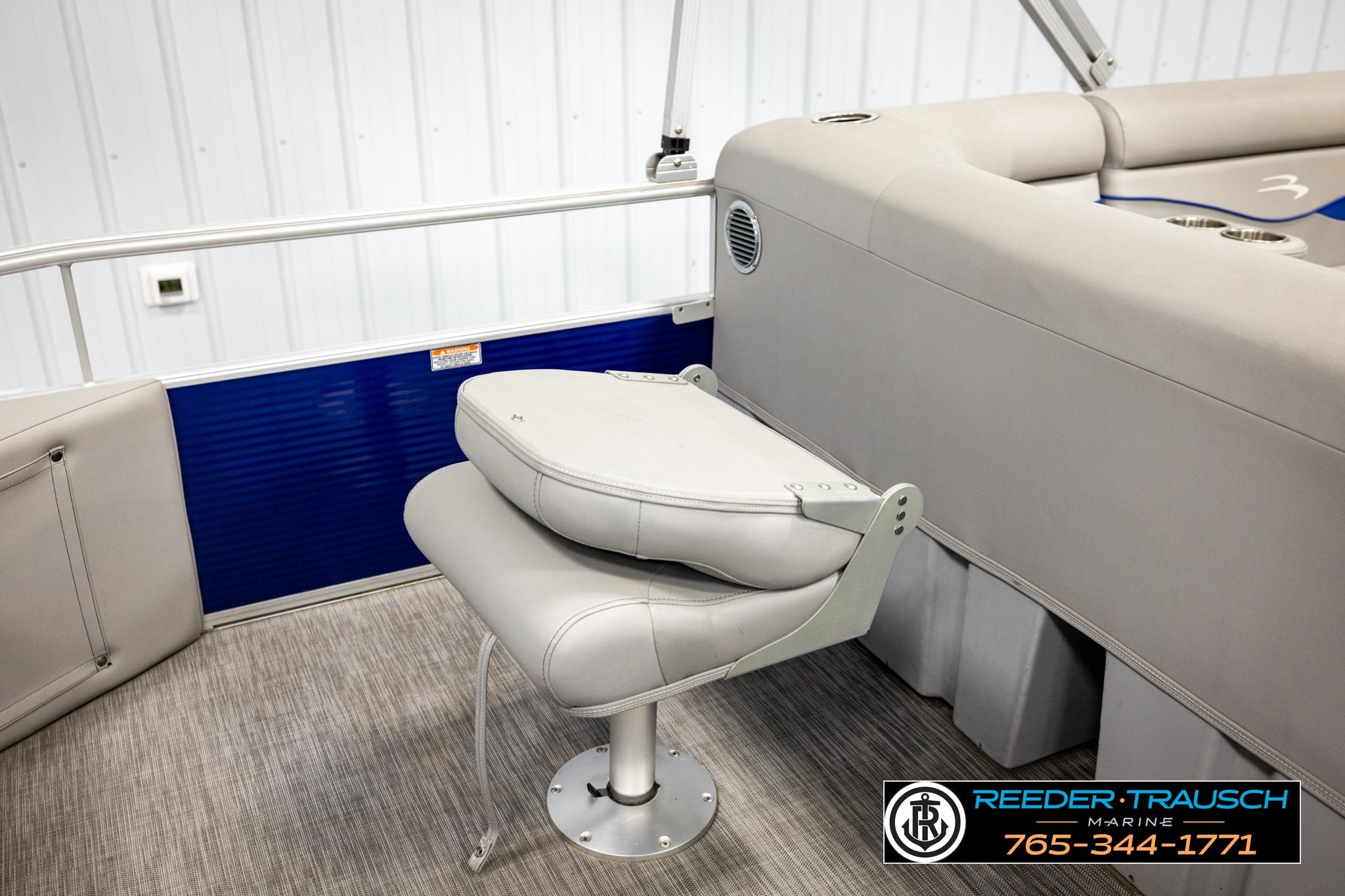 2021 Bennington 20 SV boat interior with gray seating and blue paneling.