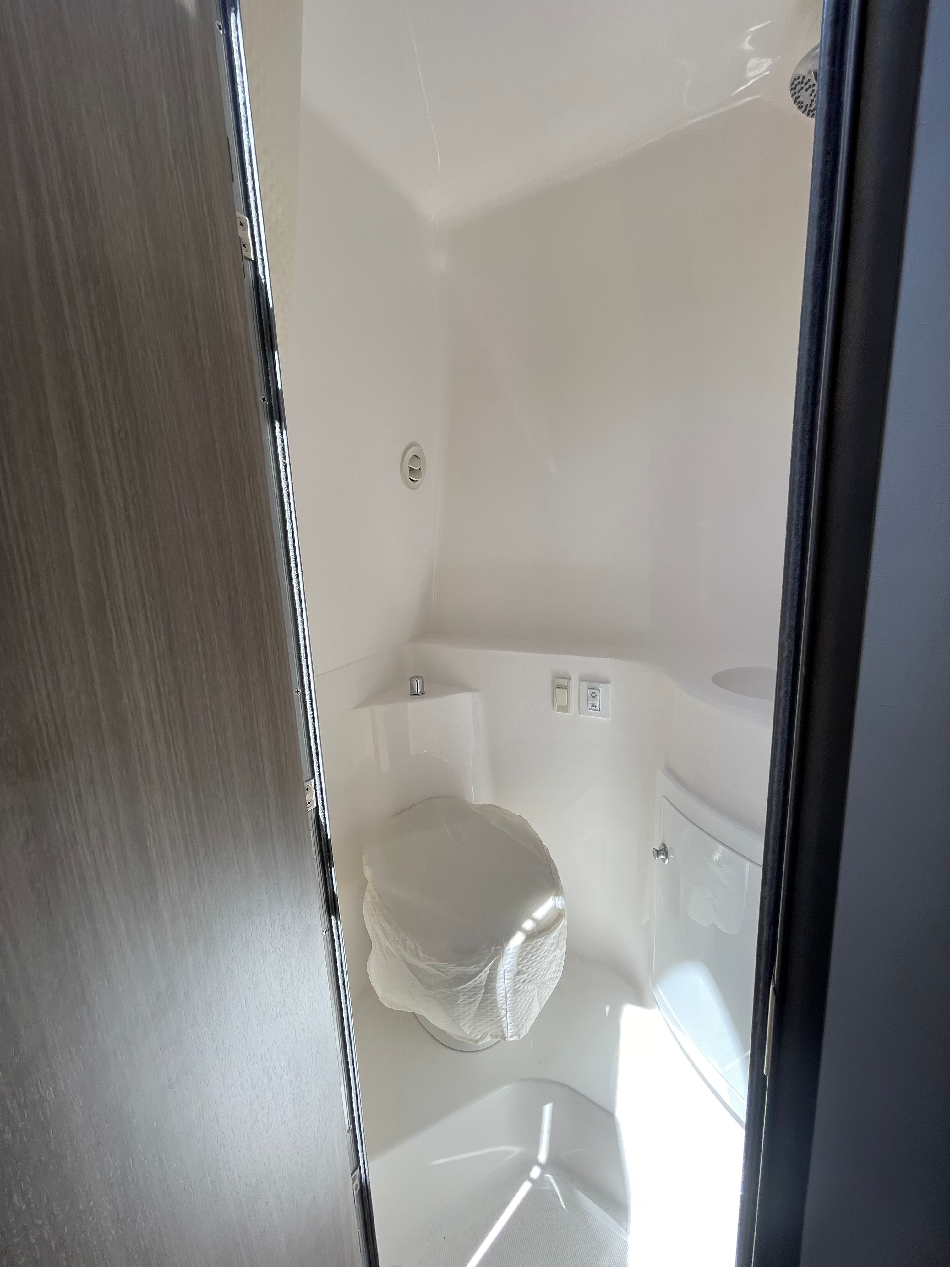 Interior of a 2022 Regal 26 Express yacht with toilet.