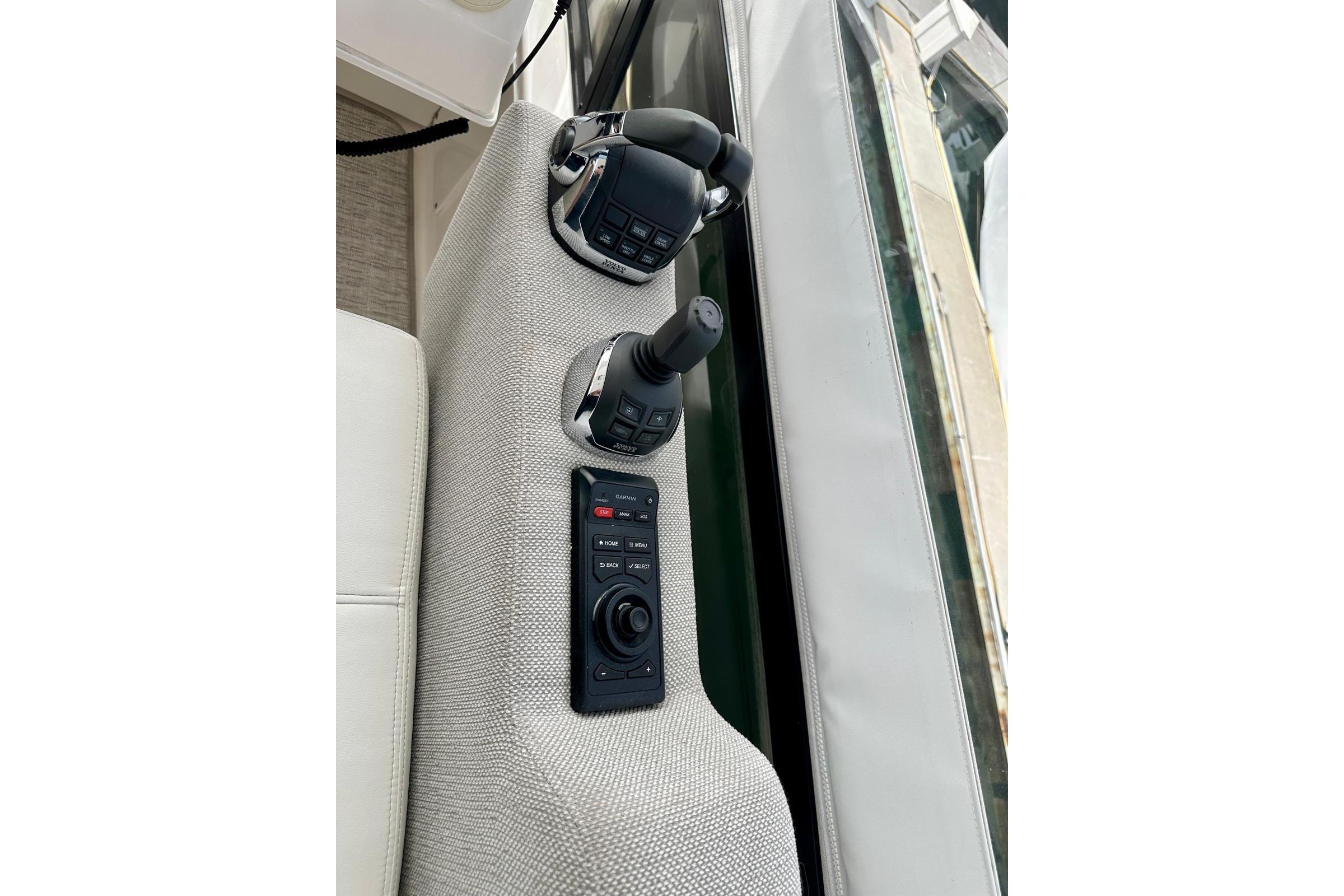 Control panel of 2019 Tiara Yachts F44 Flybridge with joystick and throttle.