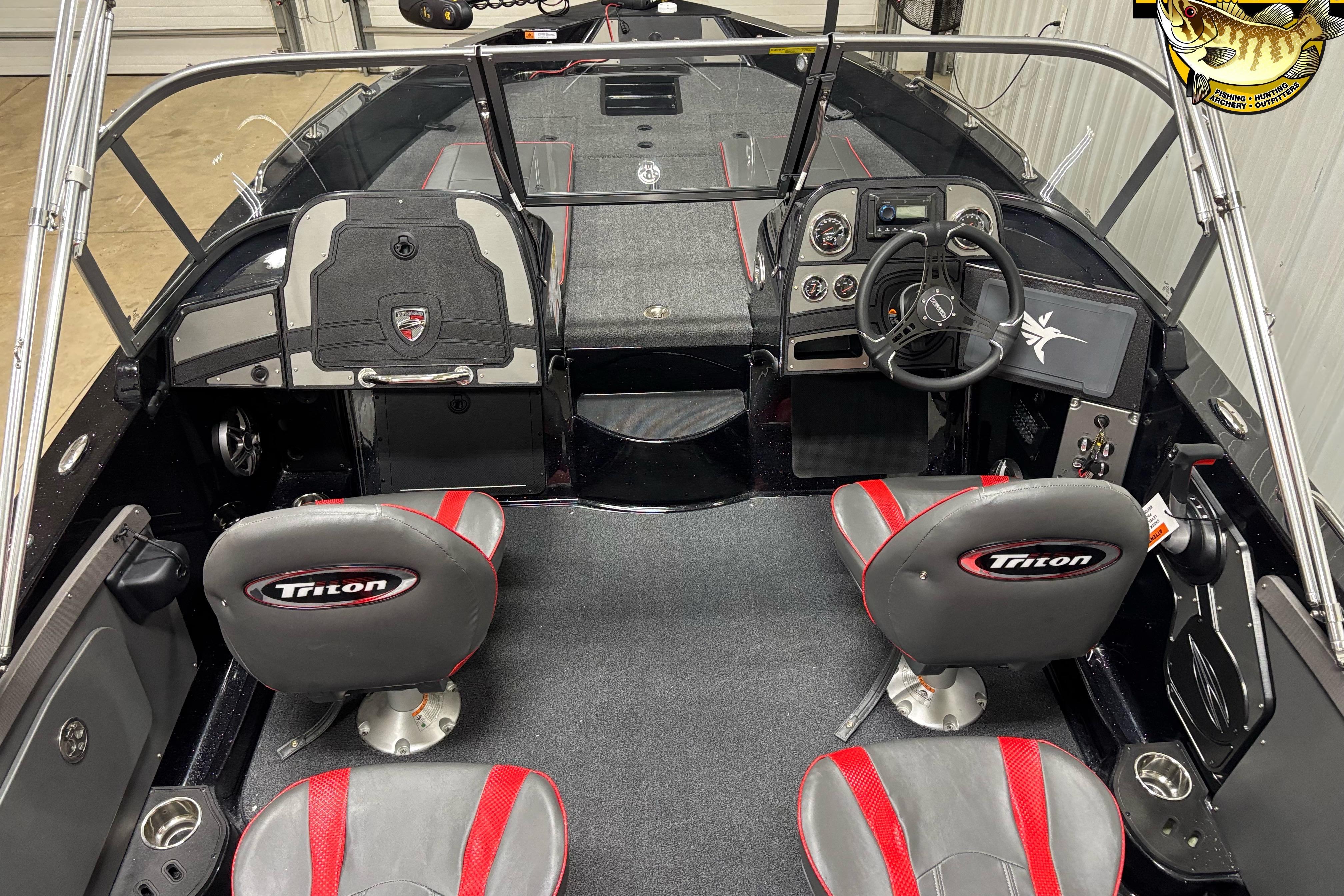 Interior of 2026 Triton 206 Allure boat with steering wheel and seating.