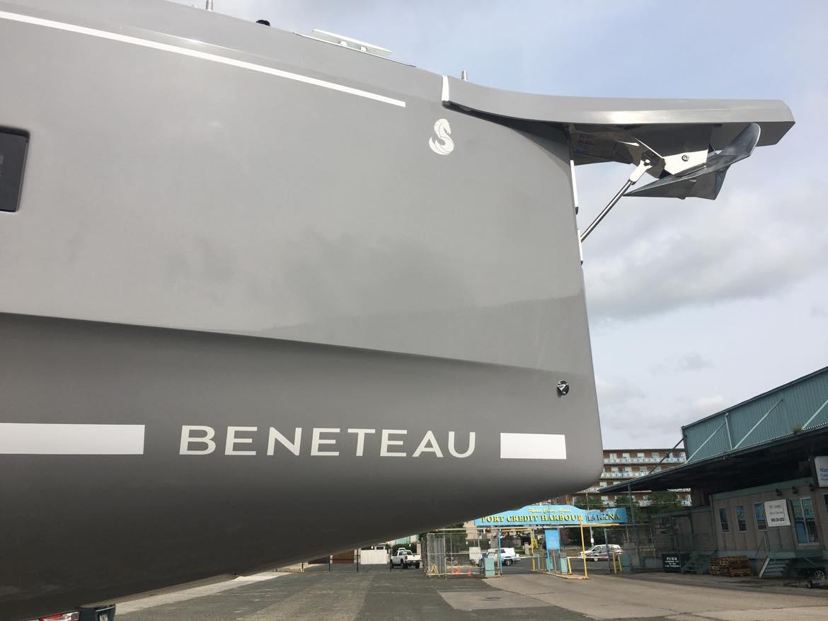 2025 Beneteau Oceanis 40.1 yacht bow in shipyard, showcasing sleek design.