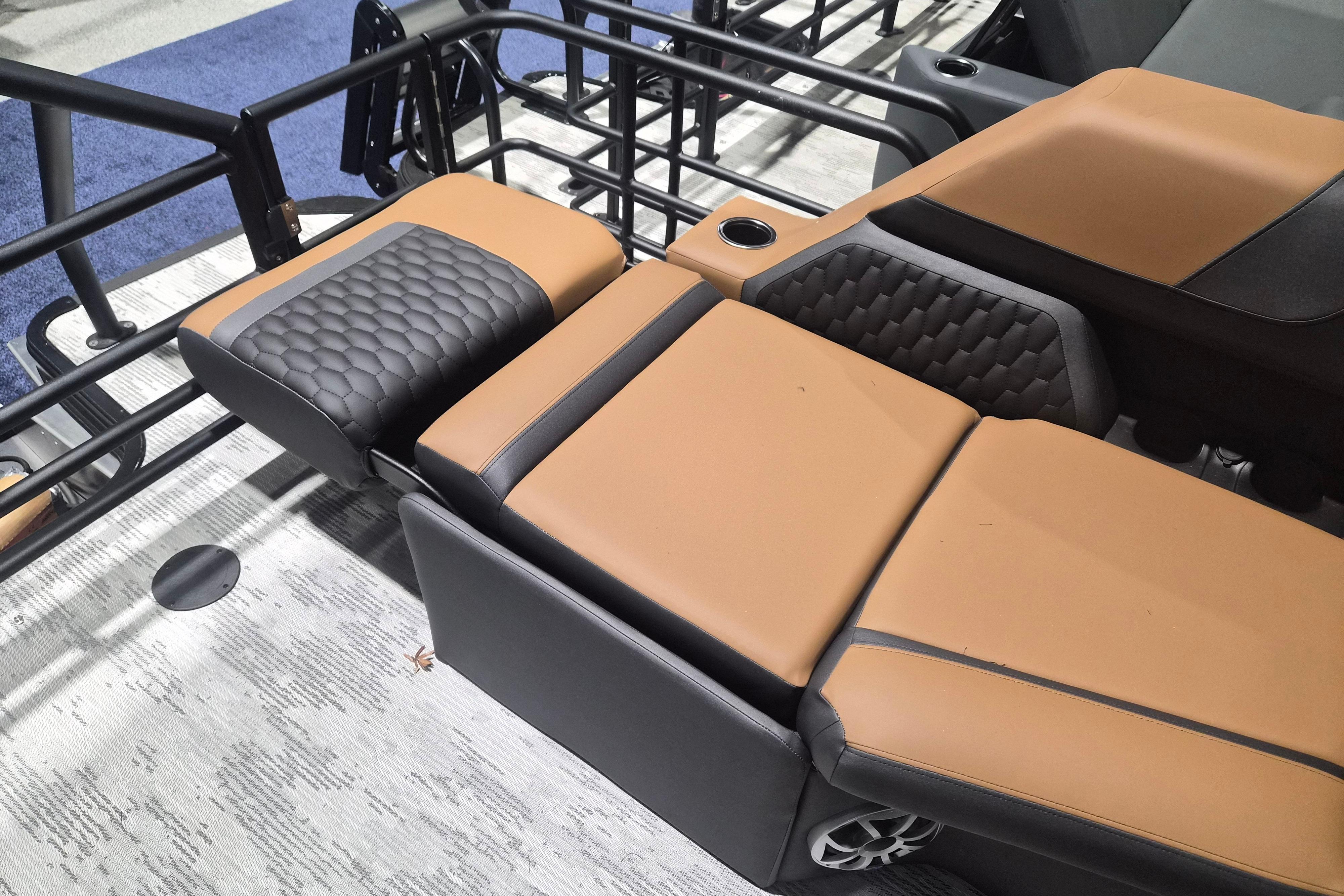 2026 Sylvan L3 SLZ boat seating with tan and black upholstery, featuring cup holders.