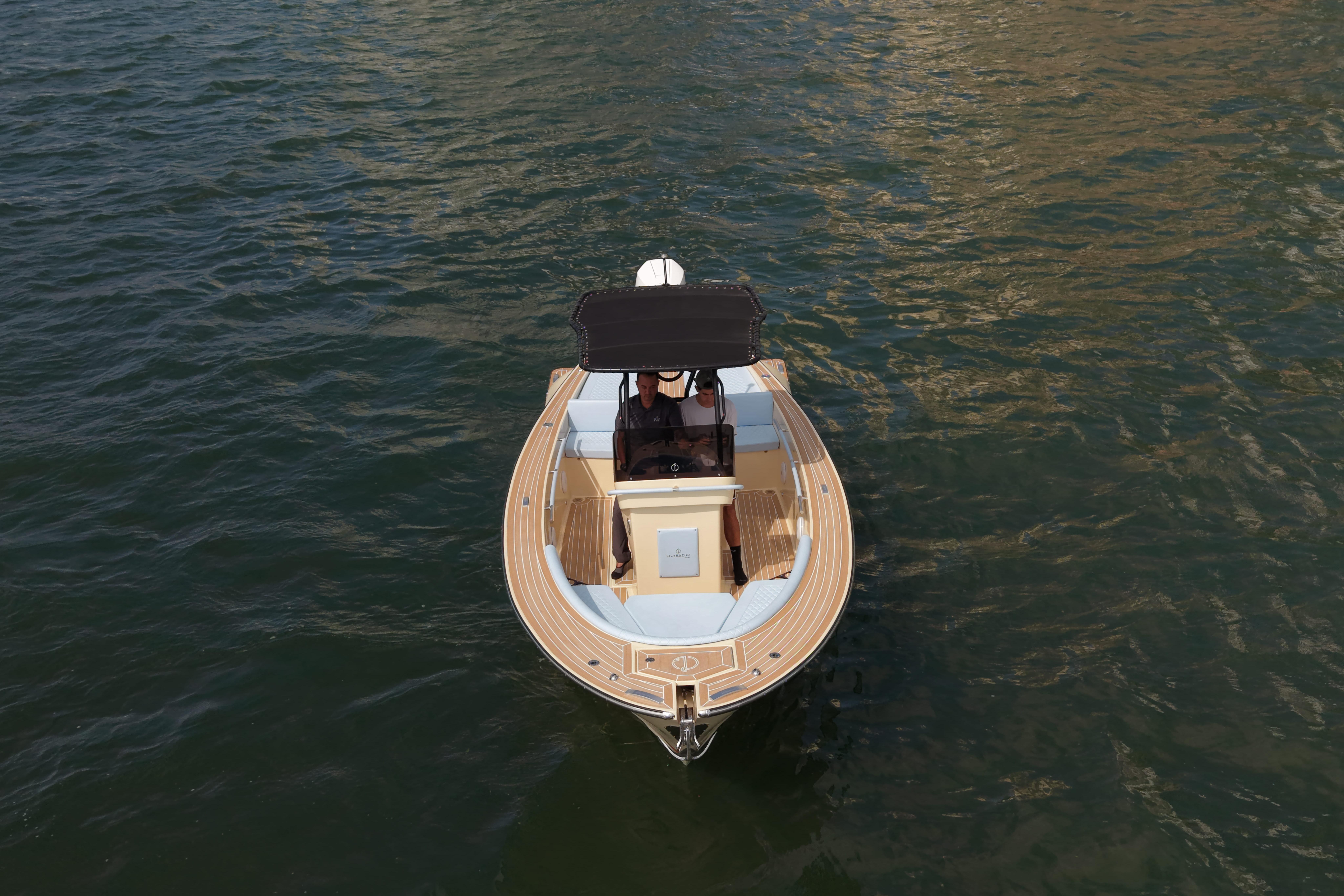 2026 Lilybaeum Levanzo 25 boat on water, top view, elegant design.