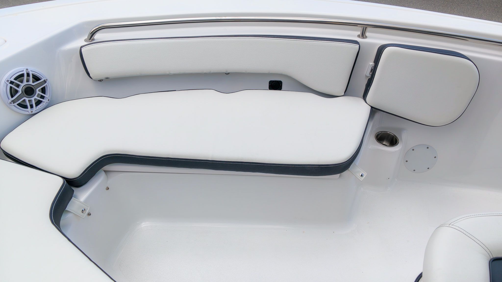 The 2027 Tidewater 198 CC Adventure features white upholstery with blue accents and a speaker.