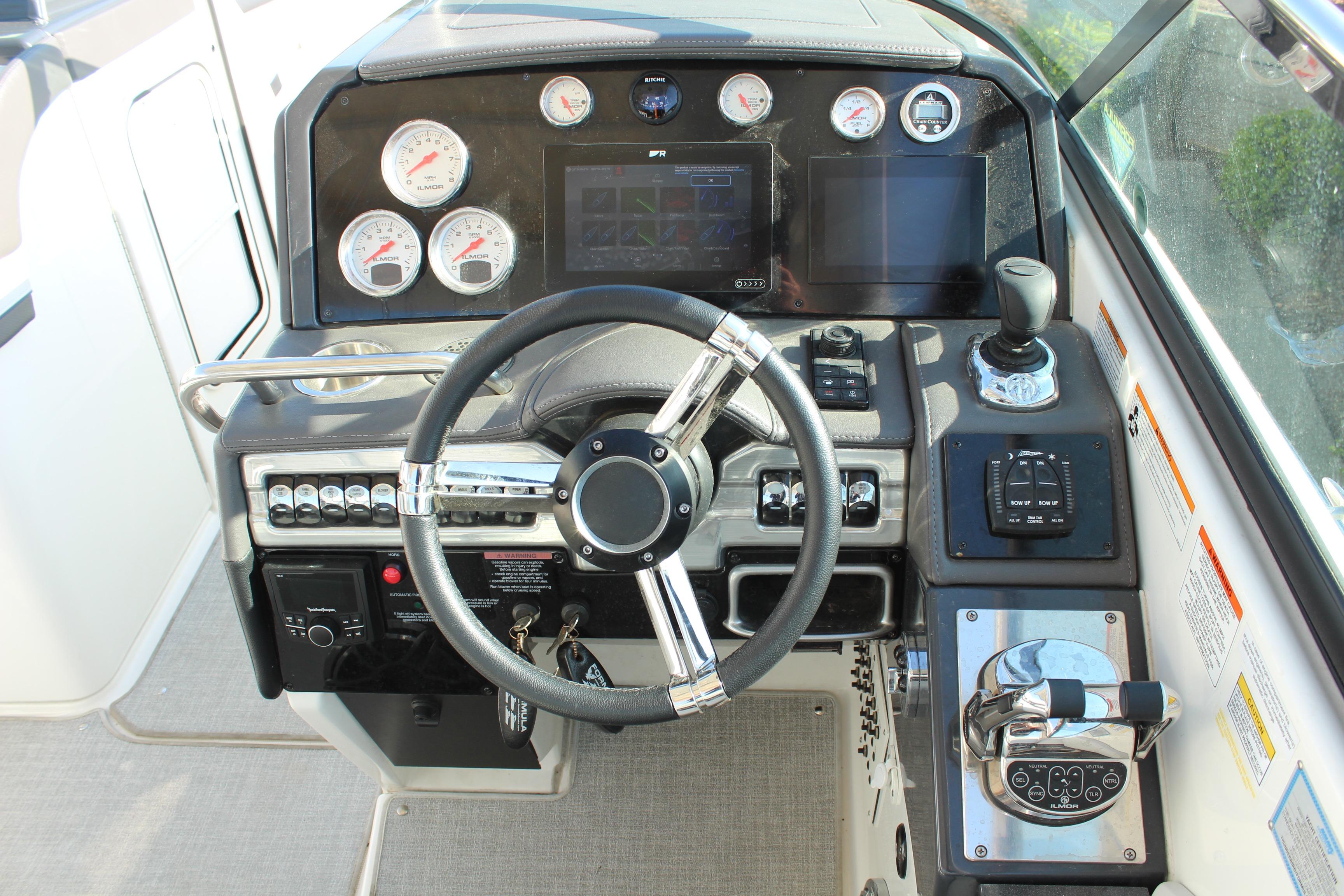 Dashboard of 2023 Formula 310 Bowrider I/O with steering wheel and control panels.