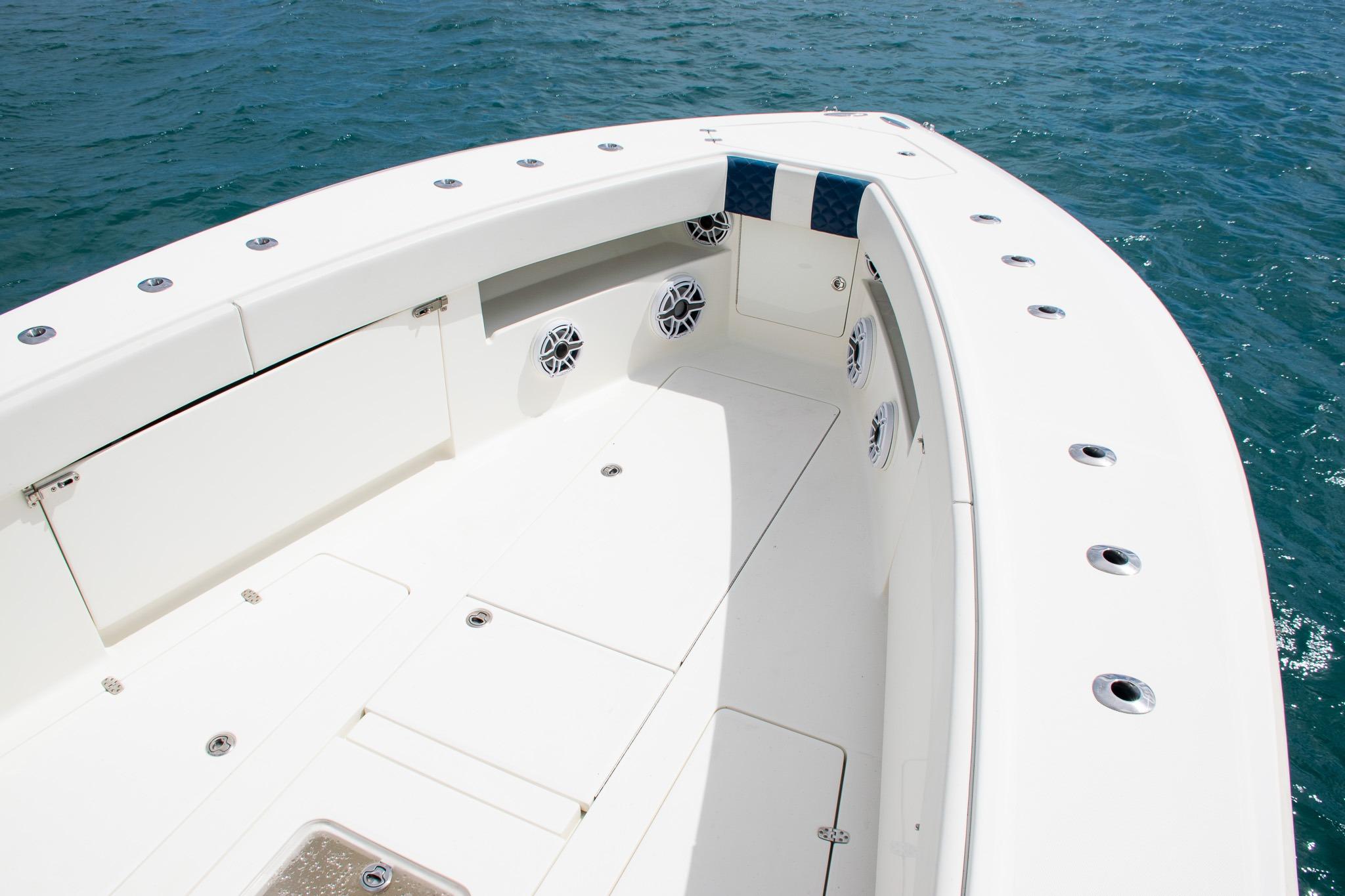 2022 SeaVee 390Z boat deck with speakers, on calm blue water.