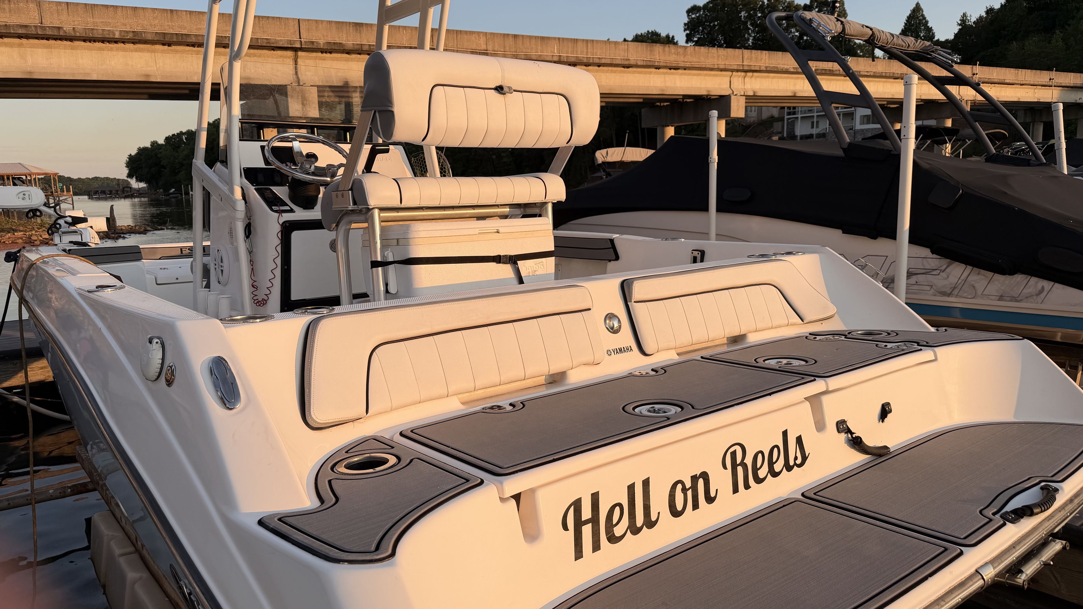 2019 Yamaha 190 FSH Sport with cushioned seats and personalized lettering on the stern.
