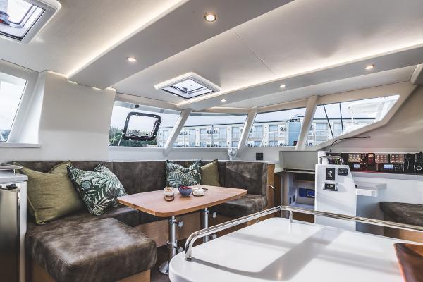 Luxurious interior of Vision 444 yacht, 2026 model, featuring modern seating and navigation controls.