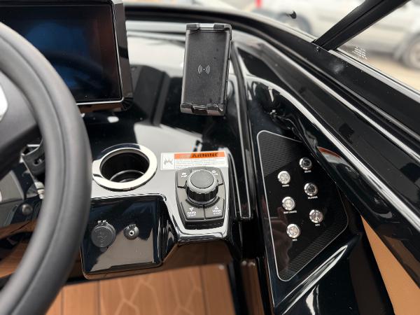 2025 Yamaha Boats 255XD dashboard with control panel and smartphone holder.