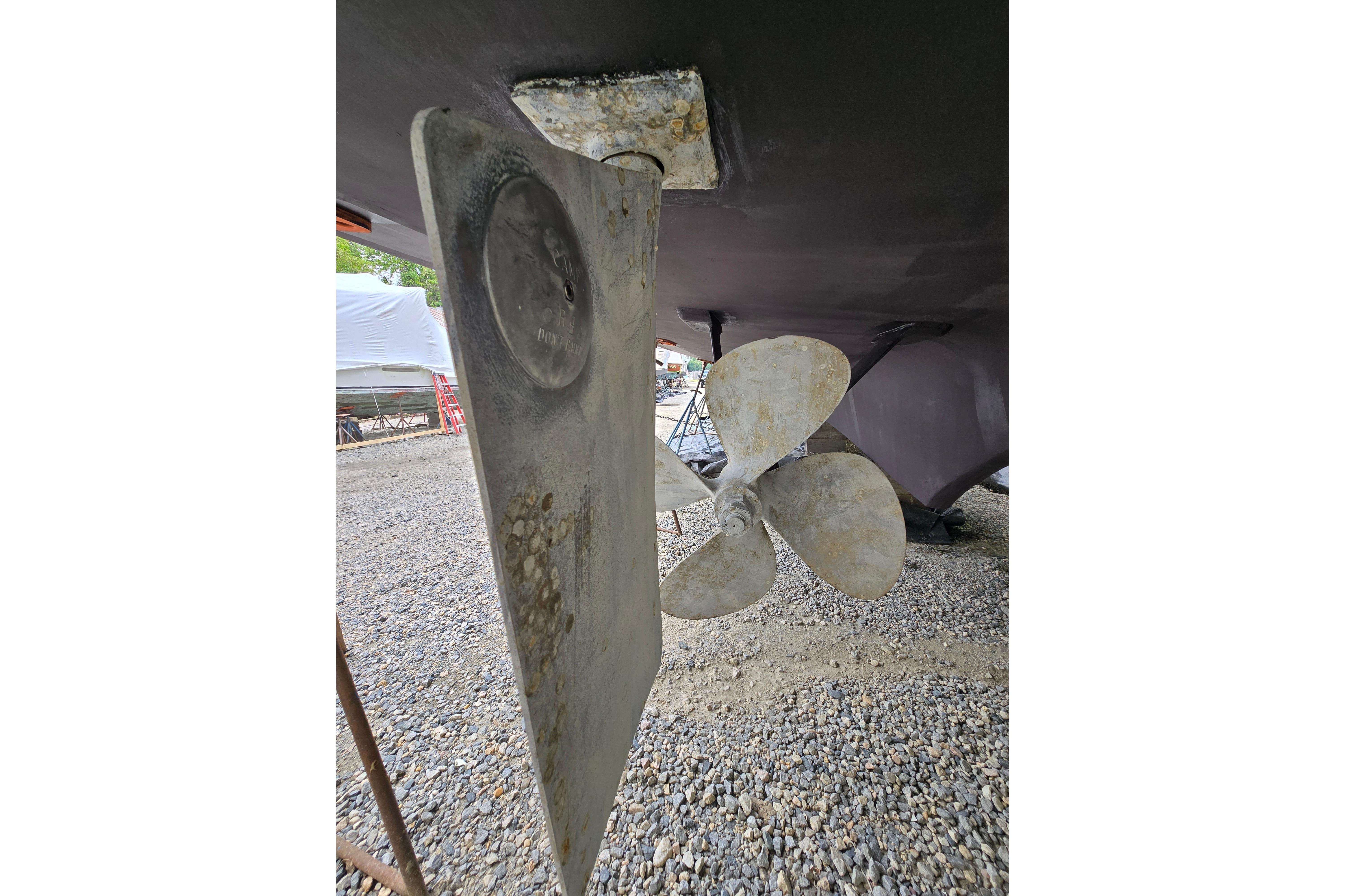 Underwater view of 1980 Hatteras 70 Motor Yacht propeller and rudder.