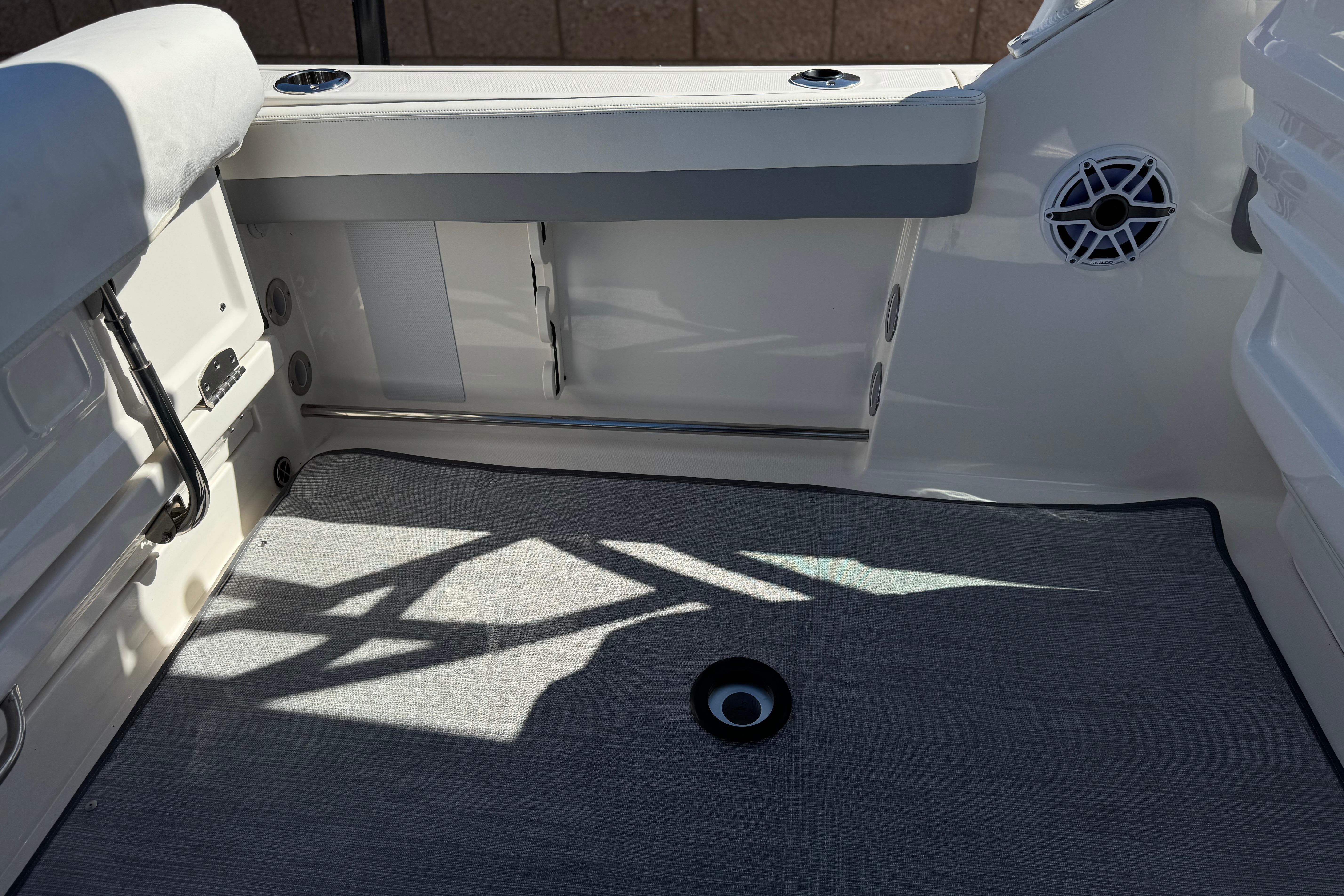 2022 Robalo R247 Dual Console boat interior with seating and speaker detail.