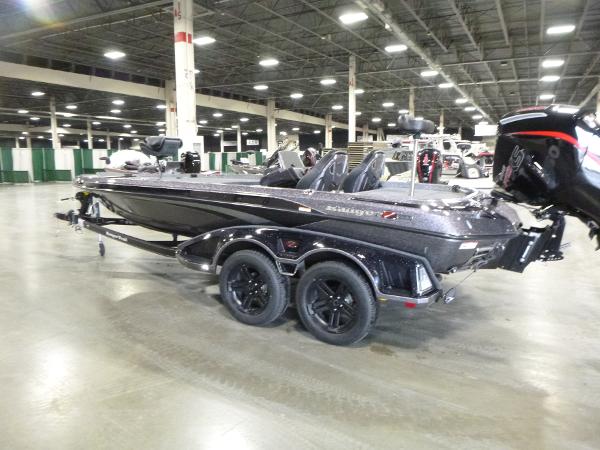 2025 Ranger Z520 boat displayed indoors, featuring sleek design and dual-axle trailer.