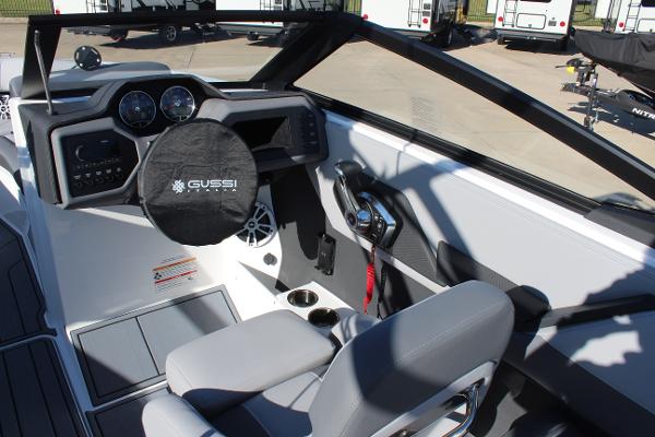 2025 Cobalt CS23 boat interior with modern dashboard and steering wheel.