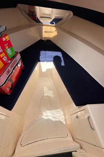 Interior of 2005 Intrepid 323 boat with life jackets and supplies.