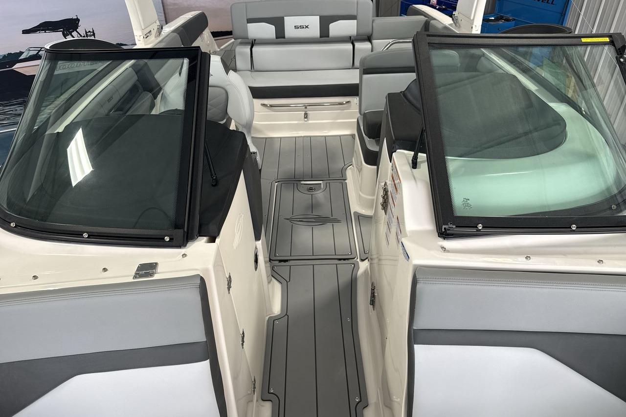The image shows the cockpit of a 2026 Chaparral SSX 4 boat with gray seating.