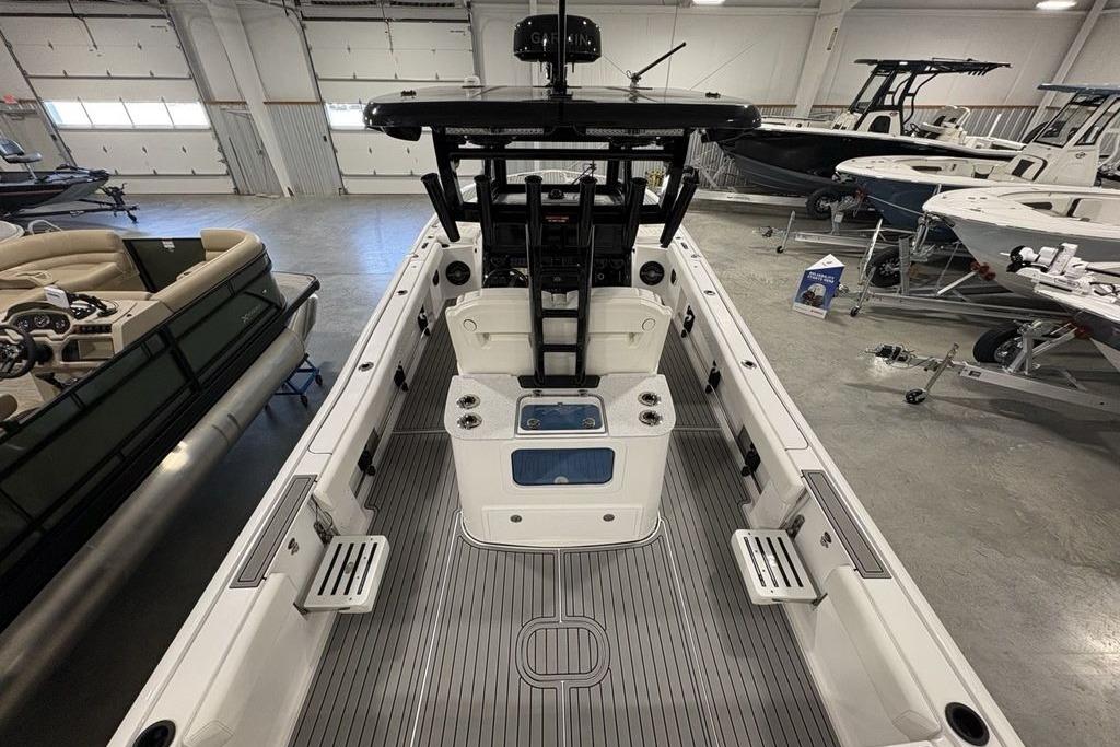 2026 Tidewater 3100 Carolina Bay boat interior in showroom, featuring sleek design and spacious layout.