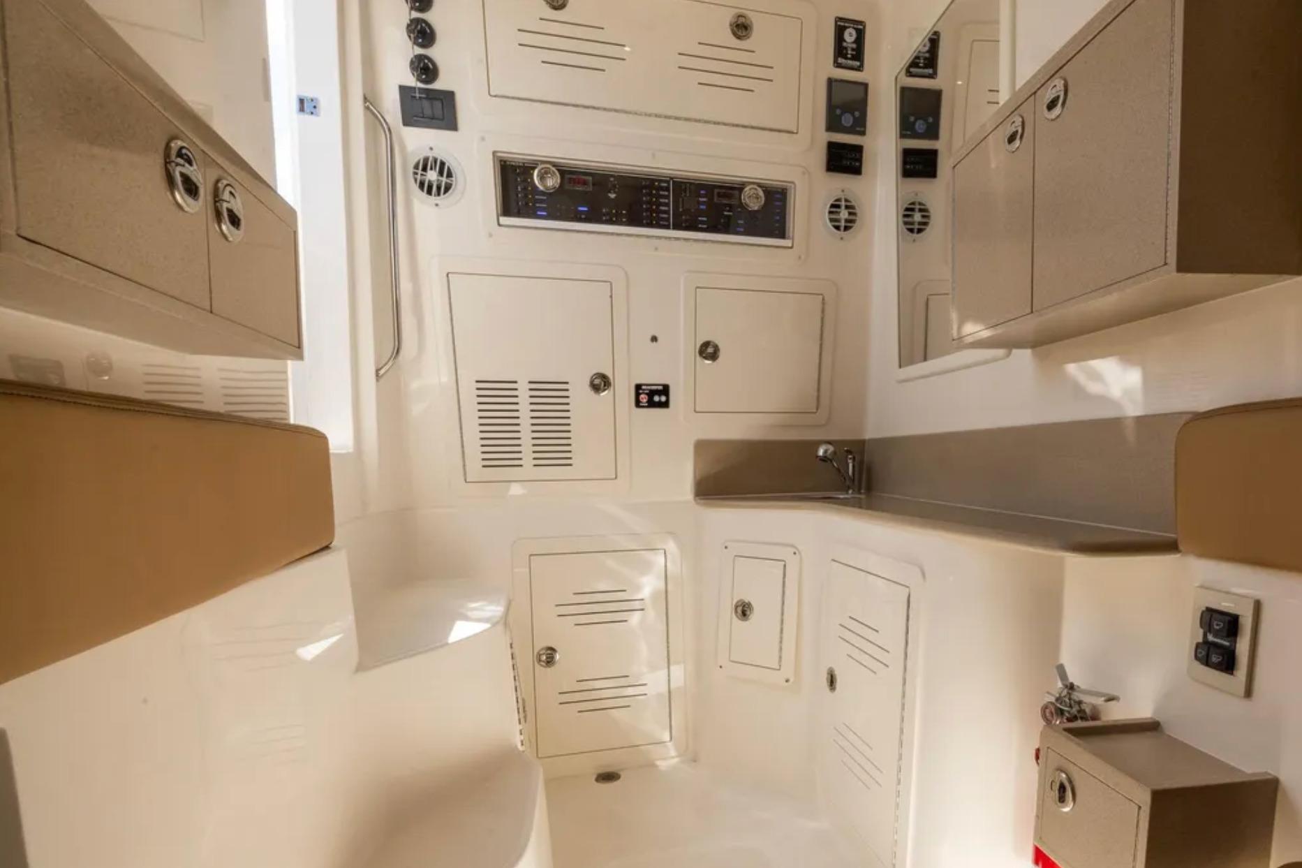 Interior of 2025 Blackwater 41 Performance Fish boat, featuring cabinets and control panels.