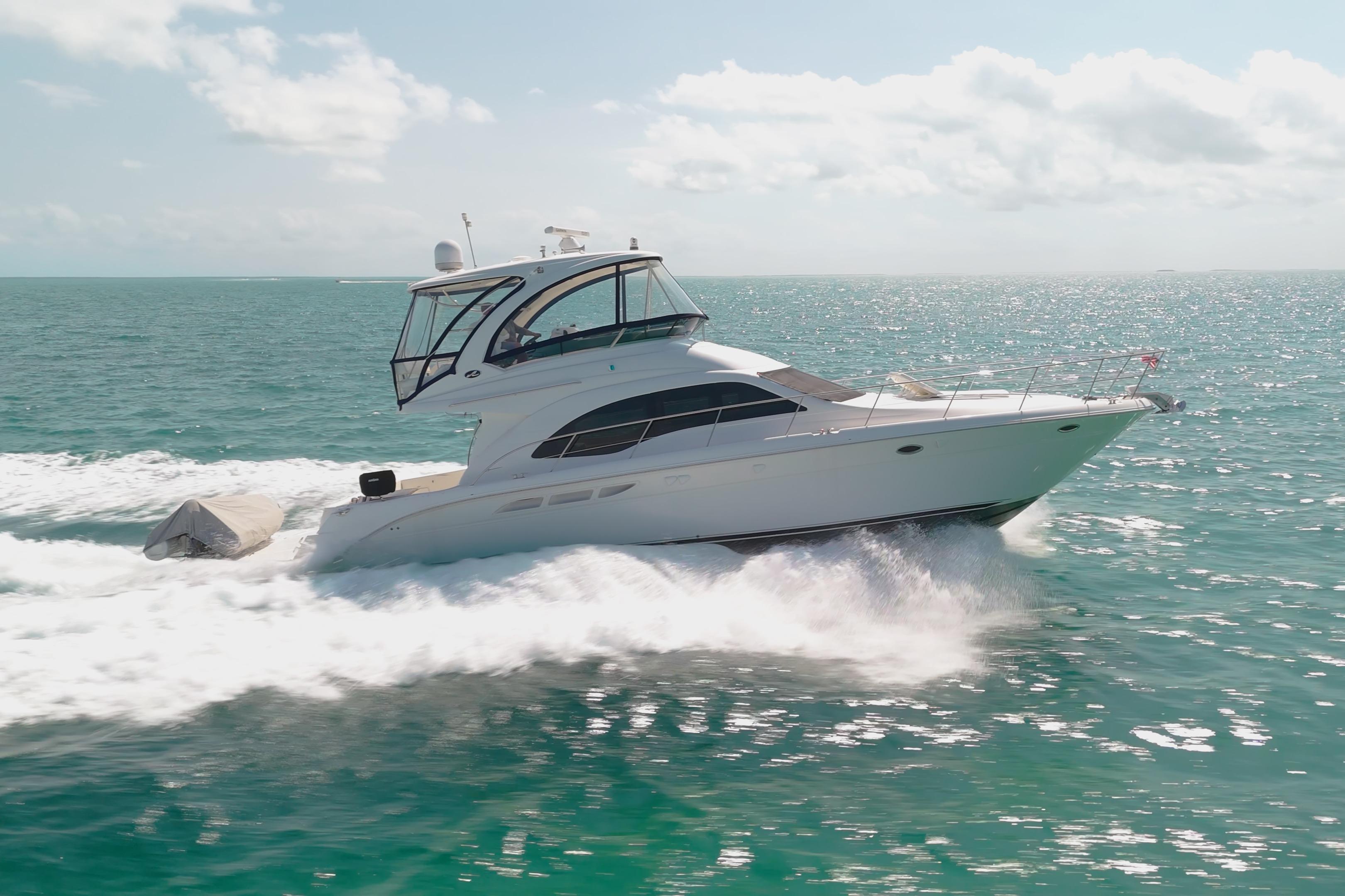 2008 Sea Ray 520 Sedan Bridge yacht cruising on open water.
