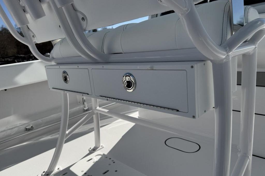 2026 Sportsman Open 232 Center Console boat storage compartments and seating detail.