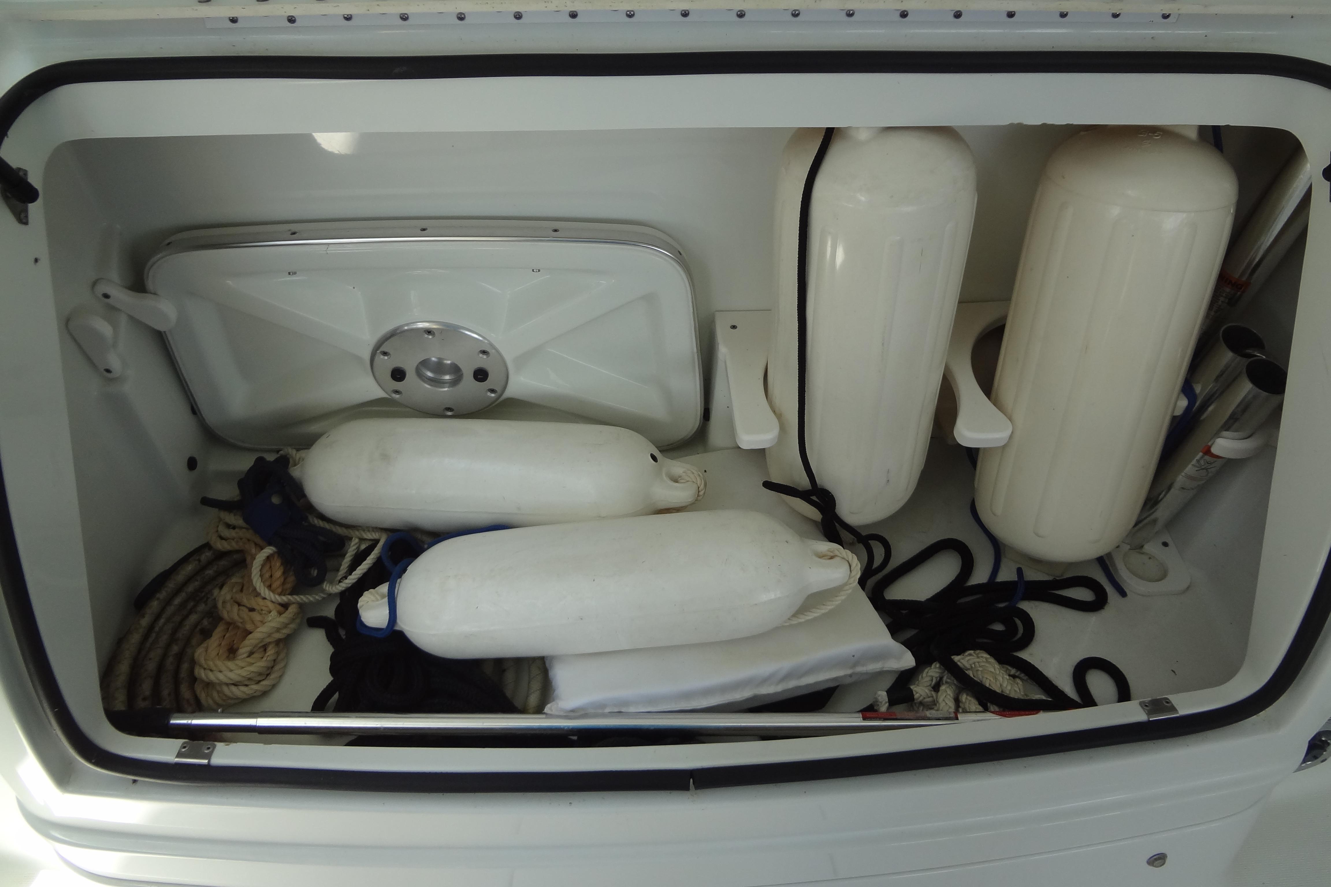 Storage compartment of 2007 Formula 34 Performance Cruiser with ropes and fenders.