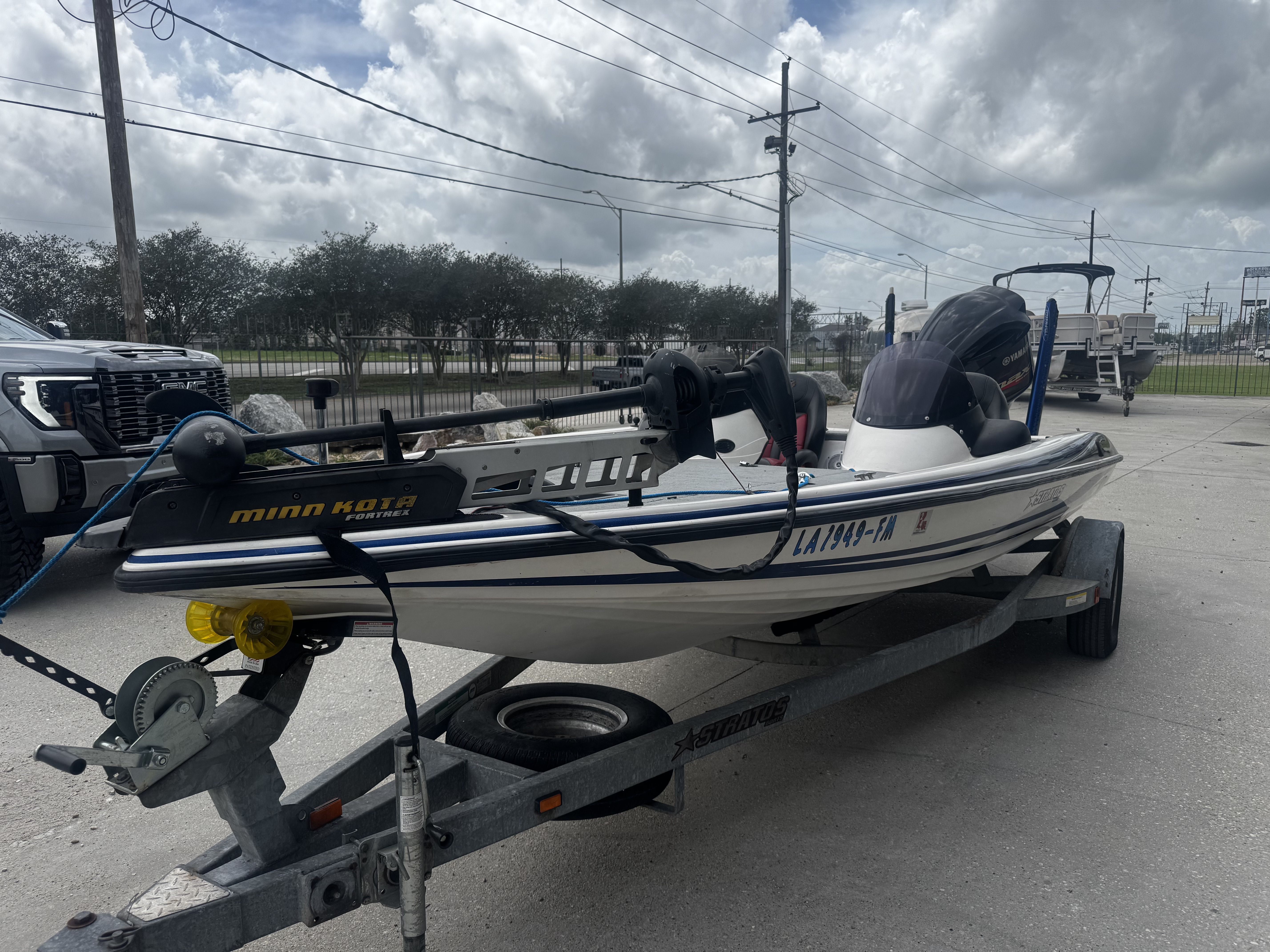 2006 Stratos 285 Pro XL boat on trailer, Minn Kota motor.