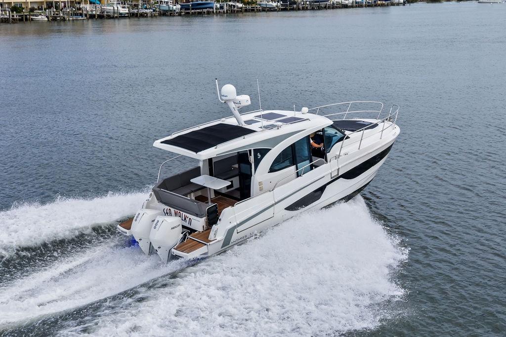 2022 Beneteau Antares 11 cruising on water, showcasing sleek design and powerful performance.