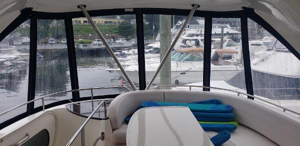 Interior view of 2010 Meridian 441 Sedan yacht with marina backdrop.
