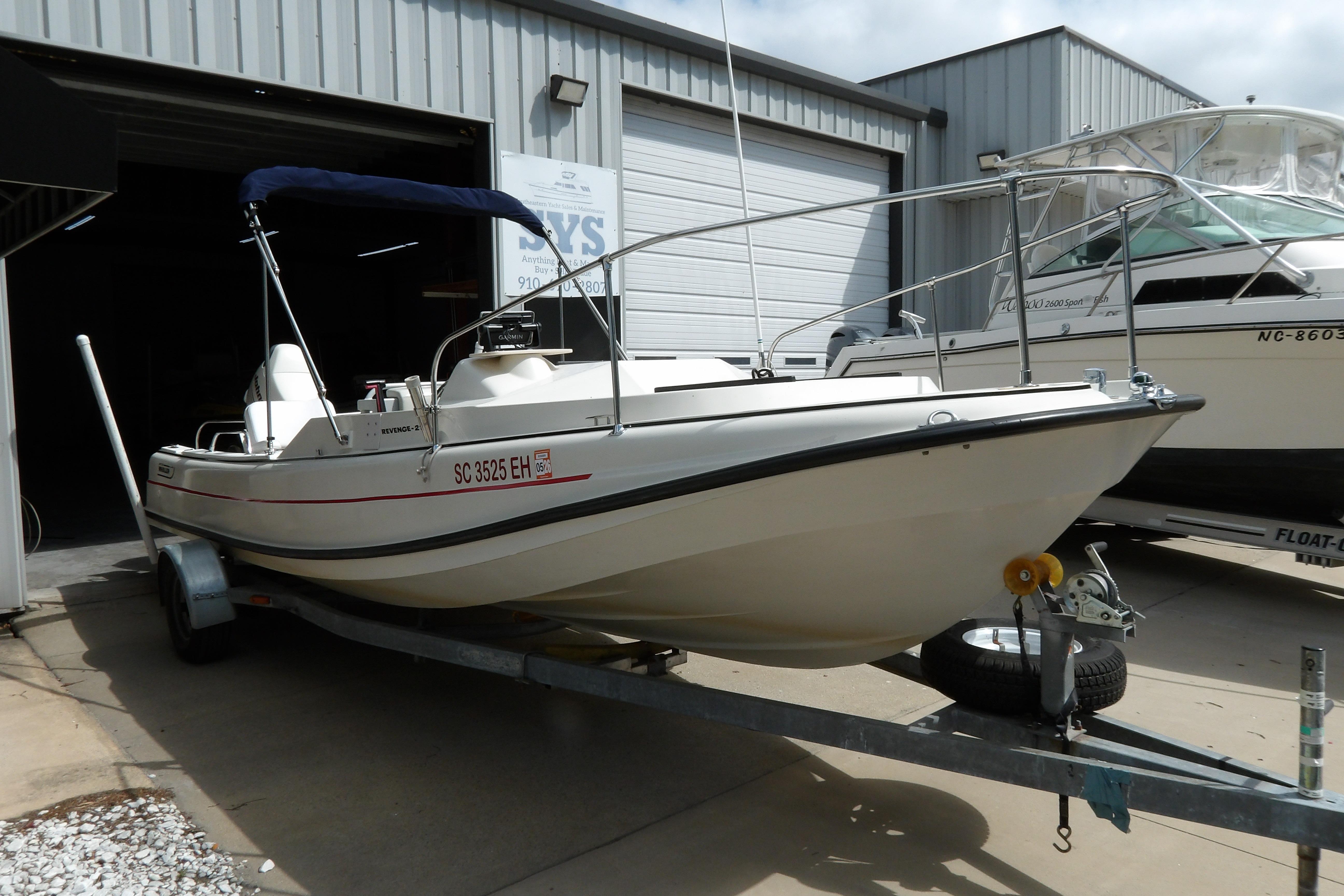 1978 Boston Whaler 21 Revenge boat on trailer outside storage facility.