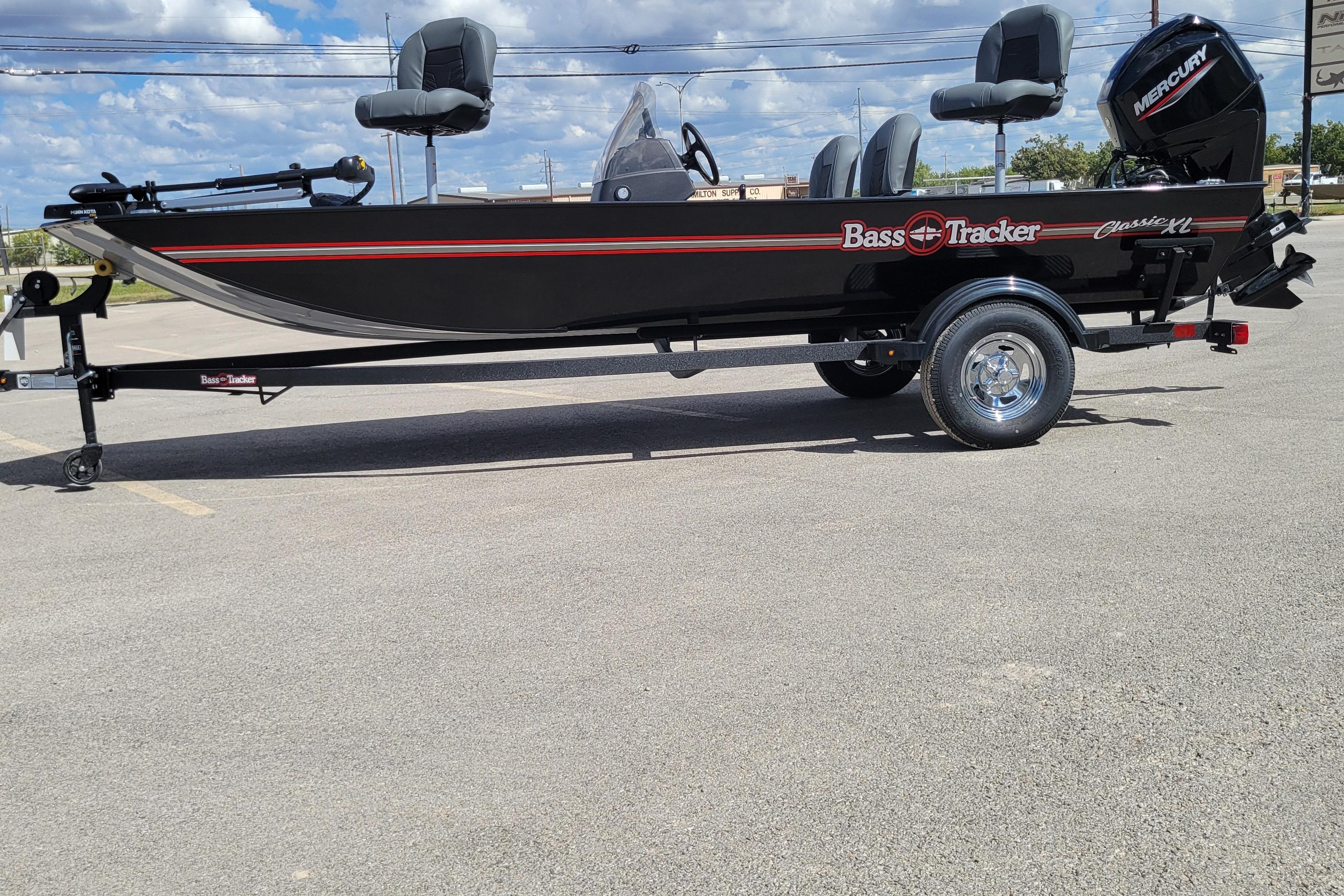 2026 Tracker Bass Tracker Classic XL boat on trailer, parked outdoors under blue sky.