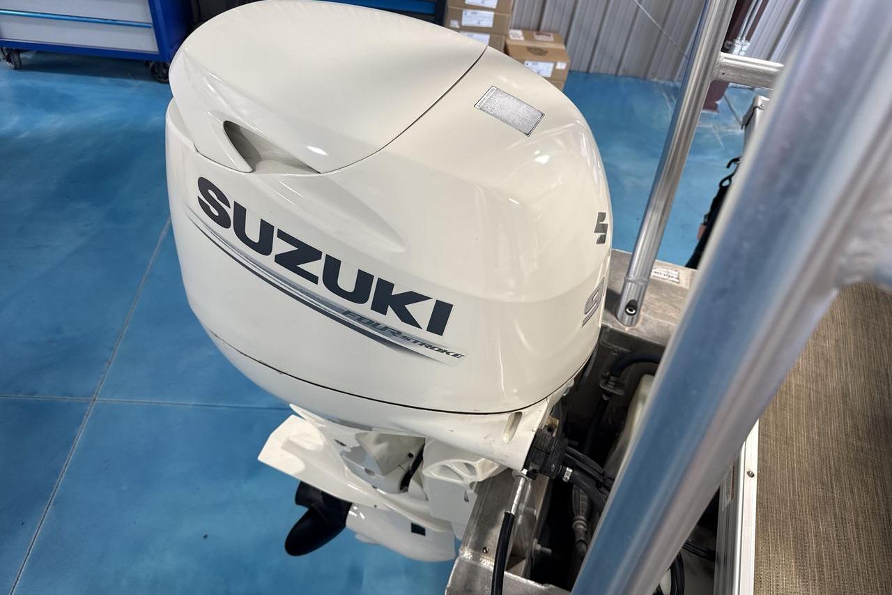 2018 Landau Alure 212 Fish with Suzuki outboard motor in a workshop setting.