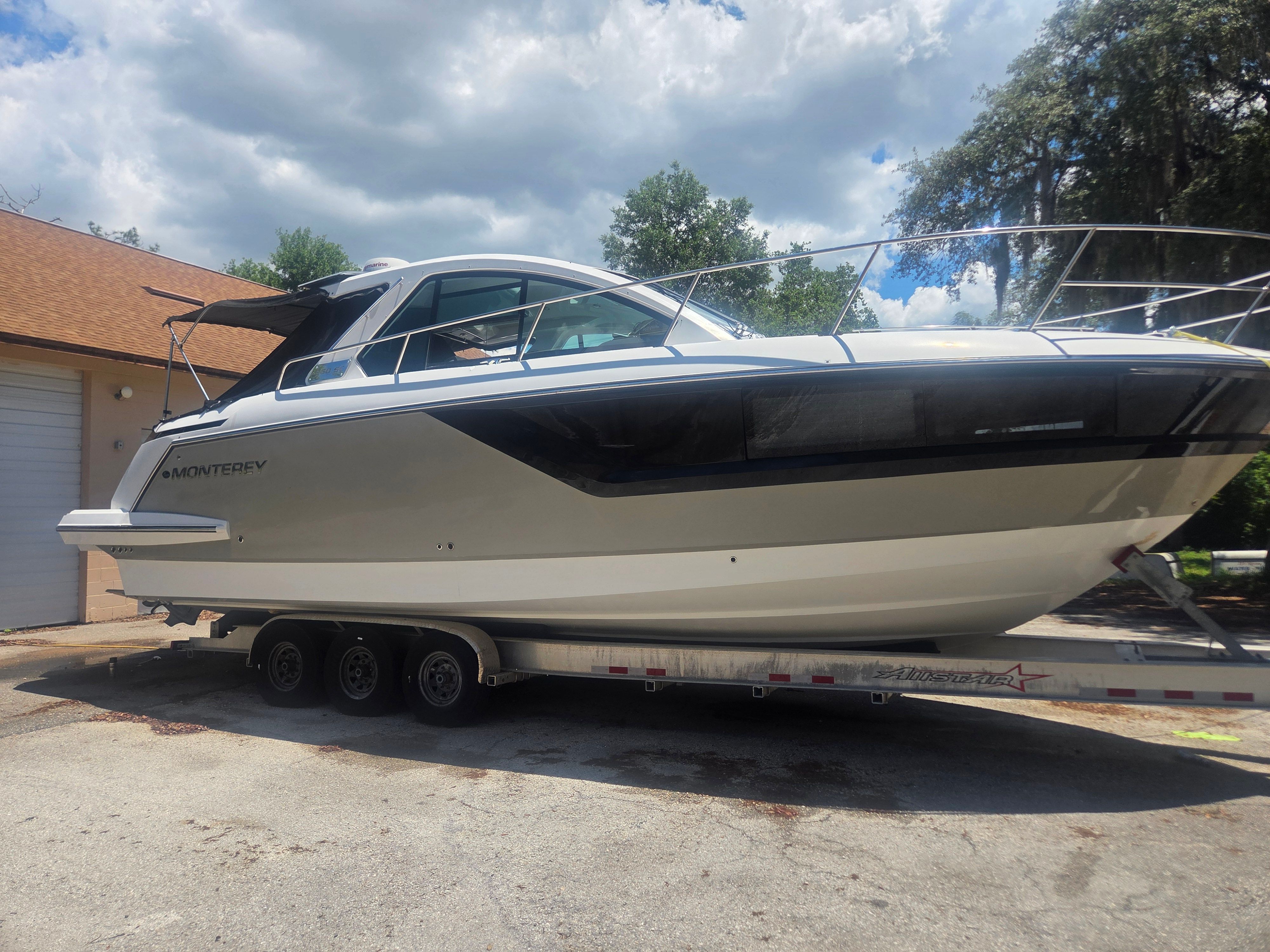 2019 Monterey 360SC boat on trailer under cloudy sky.