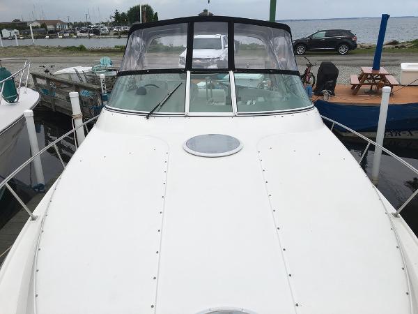 2004 Cruisers Yachts 3372 Express at dock, front view.