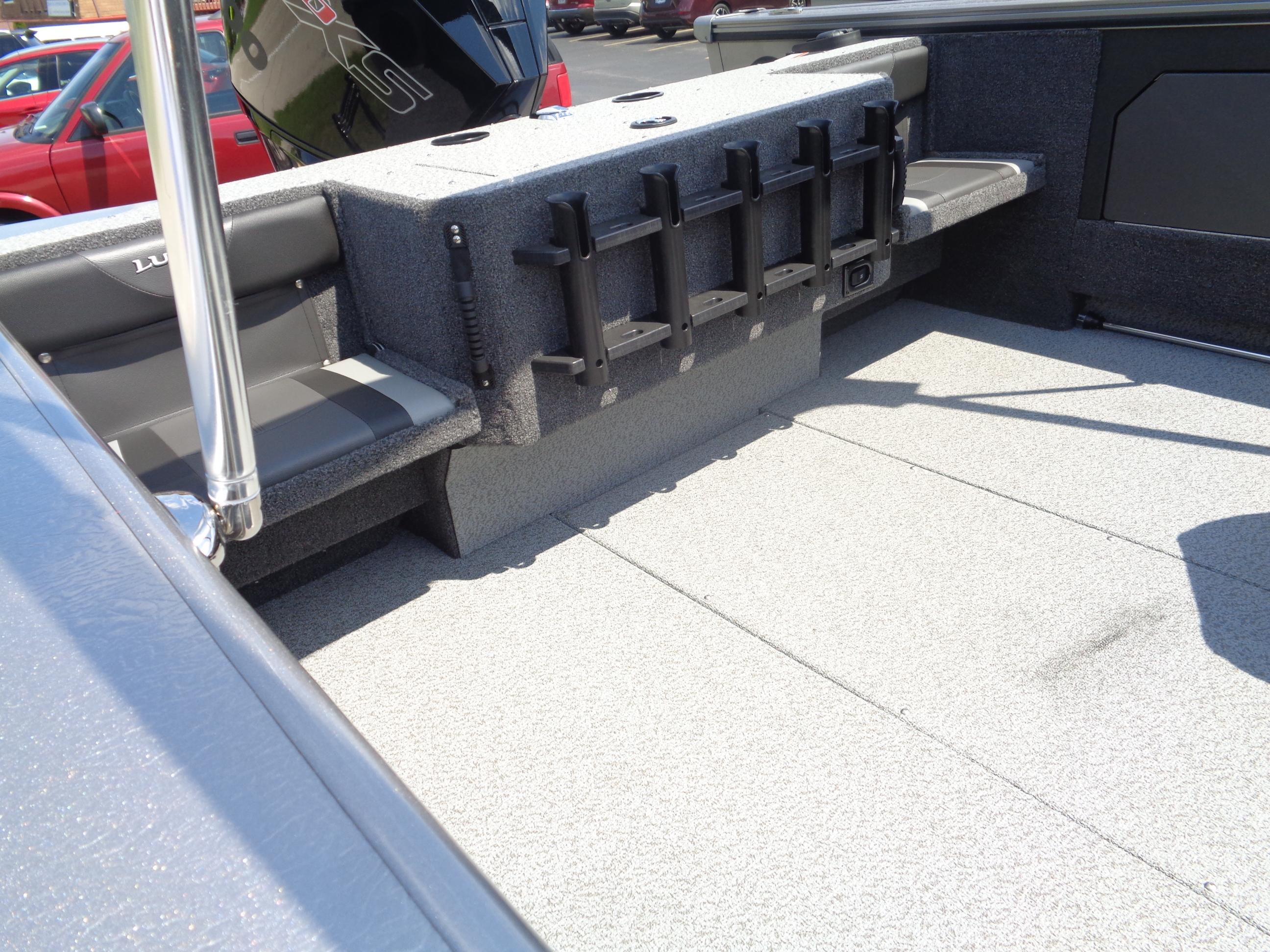 2025 Lund 2075 Fisherman boat interior with rod holders and seating.
